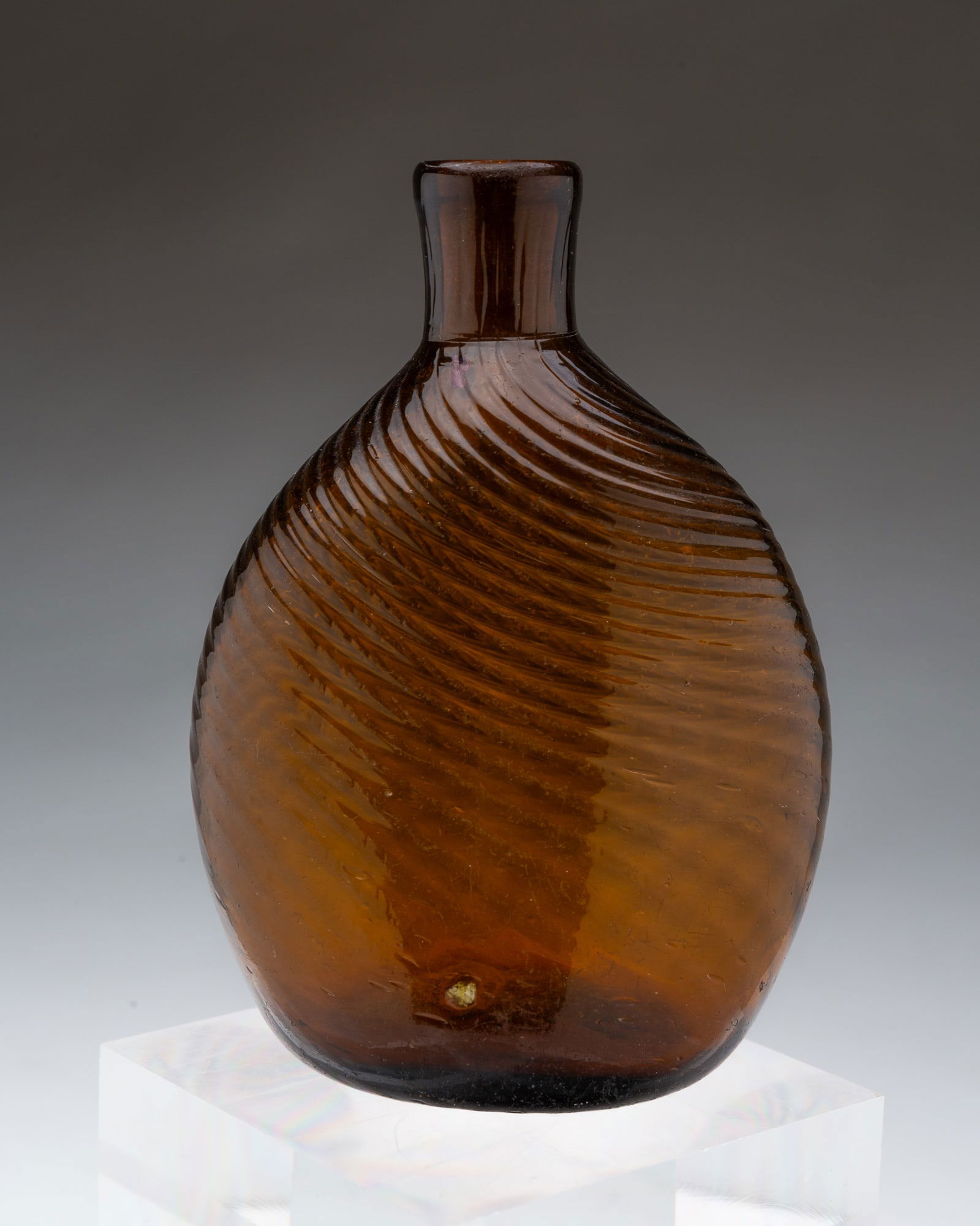 ZANESVILLE SWIRLED AMBER GLASS PITKIN FLASK. 5"h. (1 of 3)