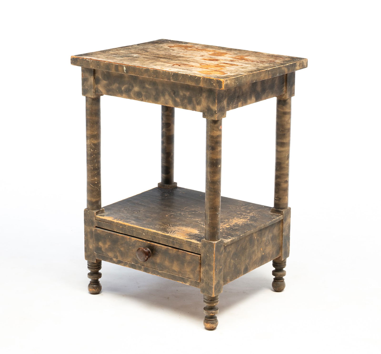 AMERICAN SHERATON SMOKE-DECORATED POPLAR WASHSTAND. 30.5"h. 22.5"w. 18"d.: Second quarter 19th century. Turned posts and feet, and bottom shelf with dovetailed drawer. Original smoke decoration.SHIPPING: All purchases from Amelia Jeffers, Auctioneers & Appraisers may be pick