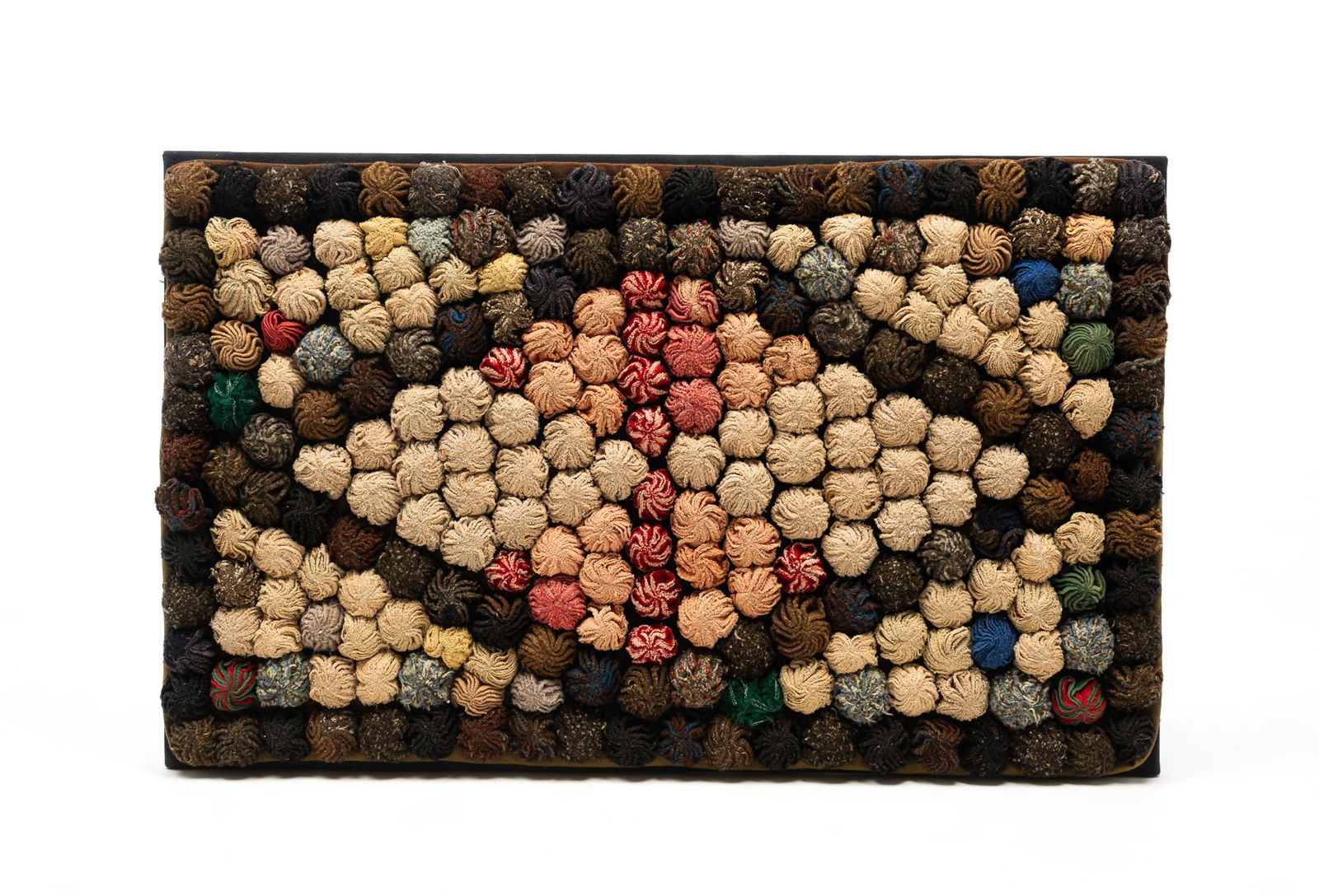 AMERICAN FOLK ART POM-POM RUG. 21"h. 34"w.: Early 20th Century. Multi-colored pom poms in a diamond pattern. On a stretcher back.SHIPPING: All purchases from Amelia Jeffers, Auctioneers & Appraisers may be picked up by you or your designated ag