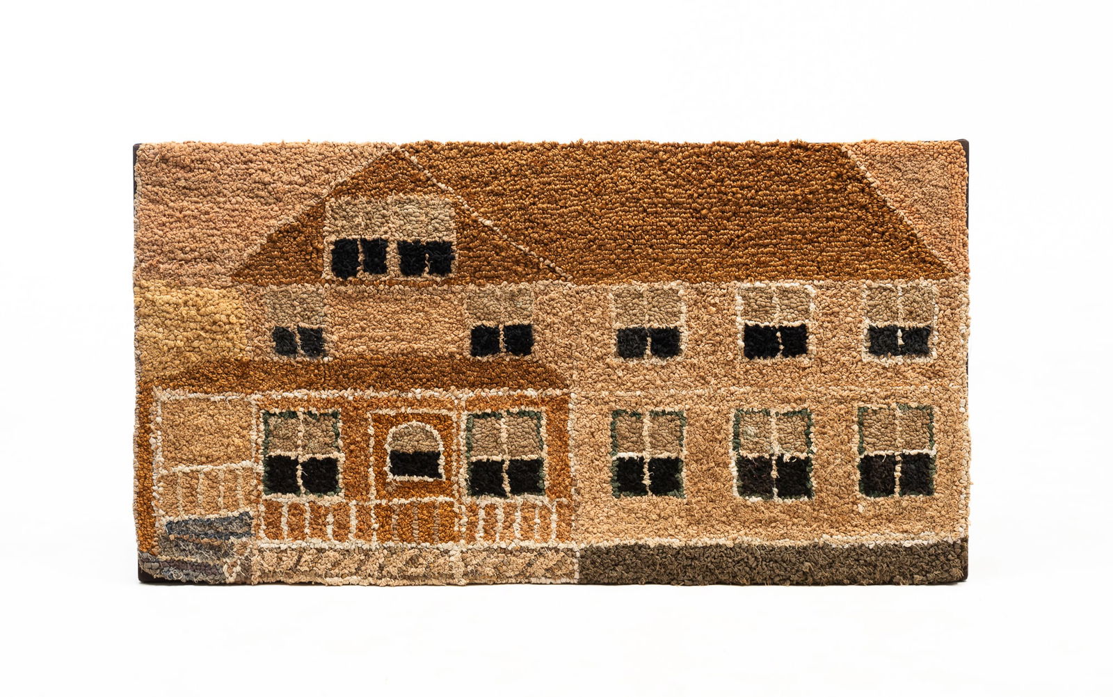 AMERICAN HOOKED RUG OF A FARMHOUSE. 20"h. 37.75"w.: Second half 20th Century. Gable and house with porch and a four-pane window. Earth tones with gray and black. Mounted on a stretcher.SHIPPING: All purchases from Amelia Jeffers, Auctioneers & Appraise