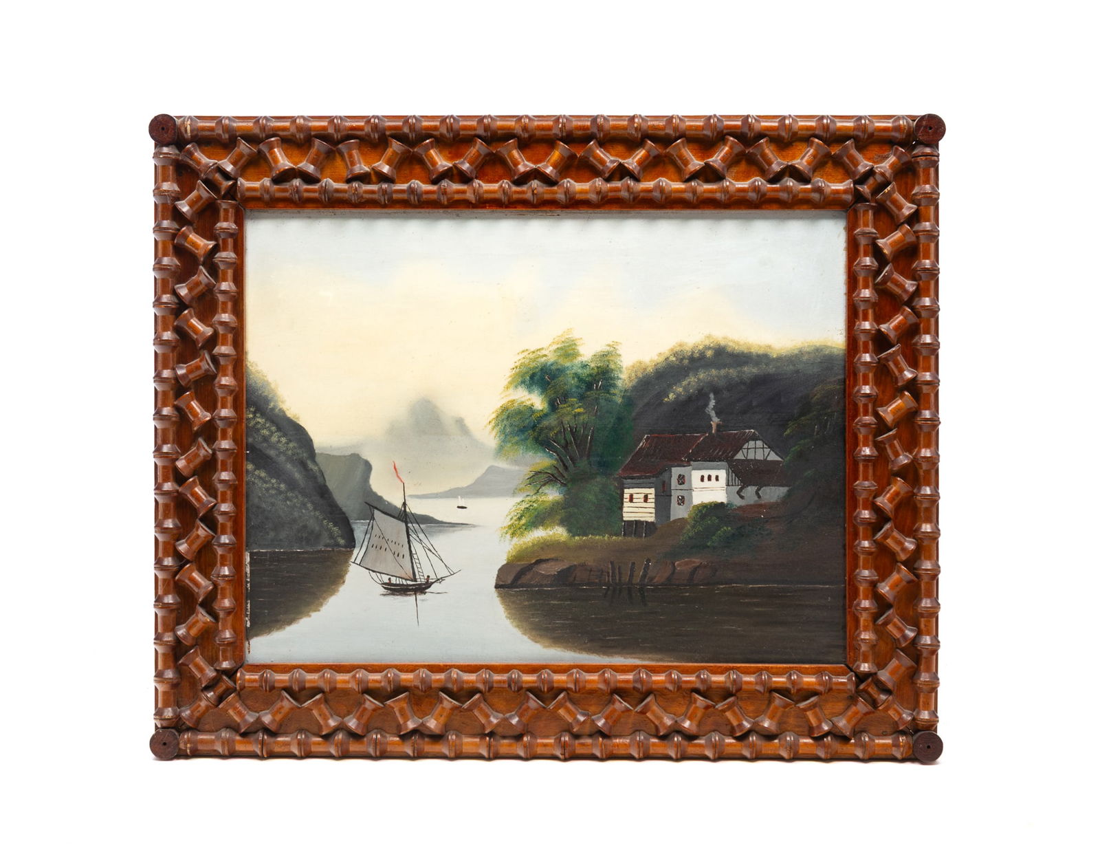 FOLK ART OIL ON BOARD OF COASTAL LANDSCAPE IN TRAMP ART SPOOL-MOUNTED FRAME. Frame, 25.75"h.: Late 19th-early 20th Century. A view of a house on the edge of the water with a masted boat sailing away under a blue sky. In a wood frame decorated with half-spools around the edges.SHIPPING: All pur
