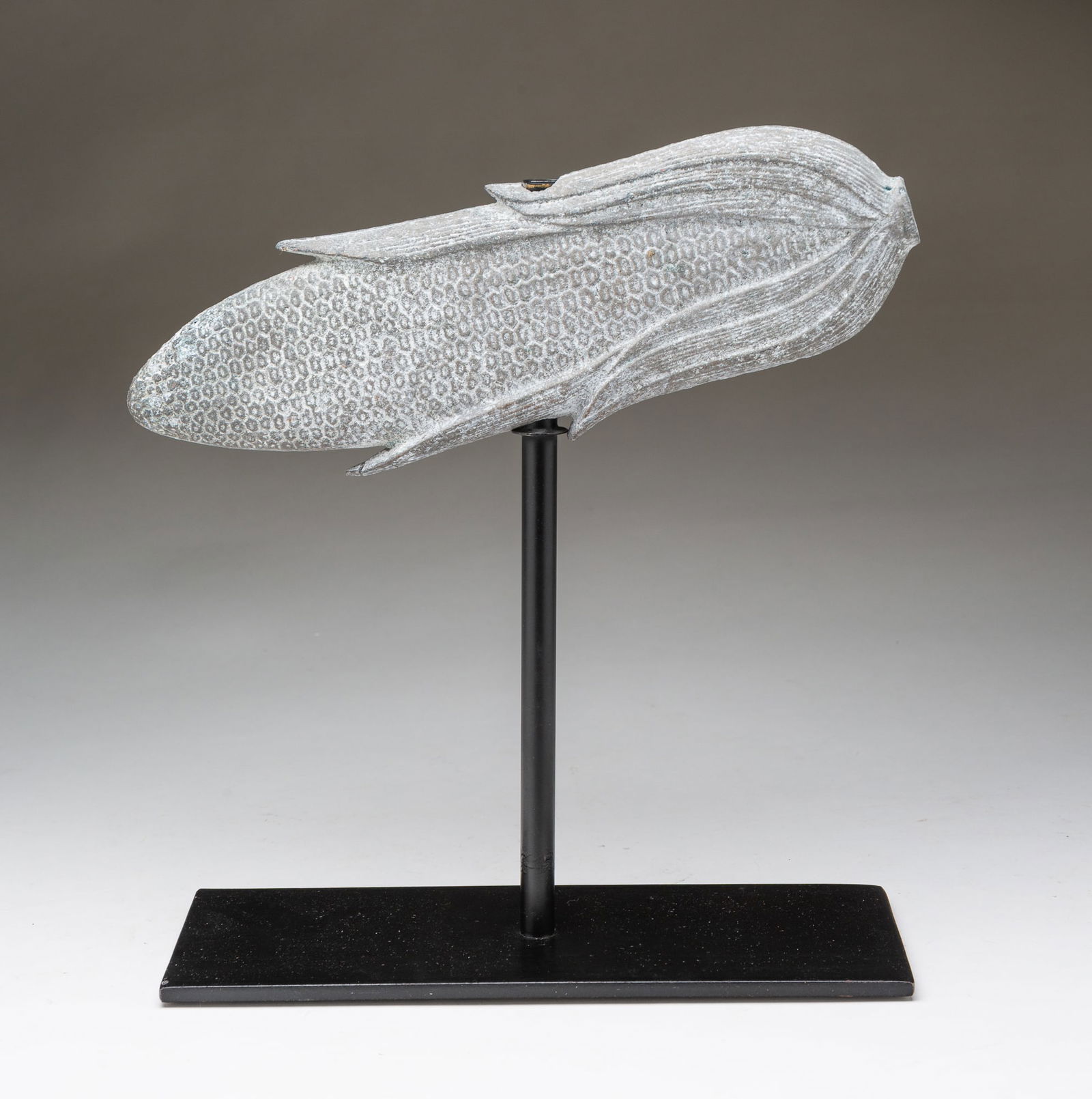 AMERICAN FOLKSY CAST STONE EAR OF CORN. 12.35"h. 10.5"w. 4"d.: Late 20th Century. Nicely detailed on a black steel stand.SHIPPING: All purchases from Amelia Jeffers, Auctioneers & Appraisers may be picked up by you or your designated agent / shipper at our conven