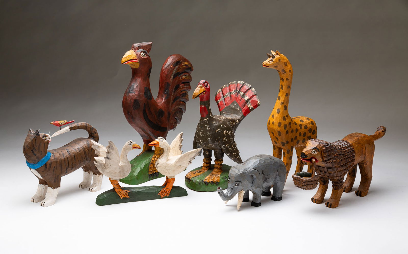 SEVEN DANIEL AND BARBARA STRAWSER (PENNSYLVANIA) FOLK ART ANIMAL CARVINGS. Largest, 11"h. 2.5"w. (1 of 8)