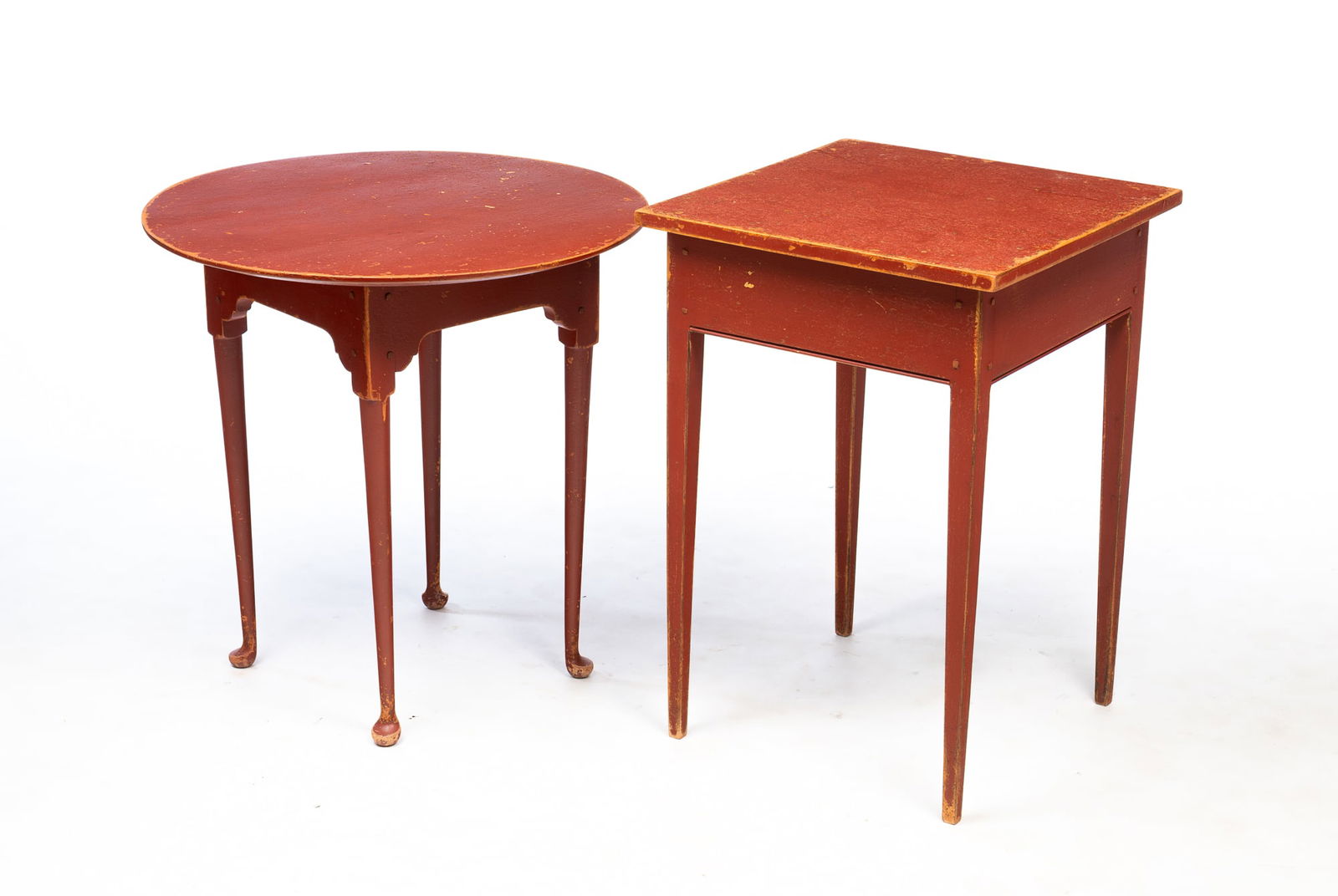 TWO DAVID T. SMITH & CO. (MORROW, OHIO) RUST RED-PAINTED POPLAR STANDS. Largest, 27"h. 18.75"w.: Late 20th Century. A round top Queen Anne style tavern table, shaped apron corners, slender tapered turned legs, and pad feet. Pegged construction. 25"h. 24.75"d. And a Hepplewhite style stand, beaded