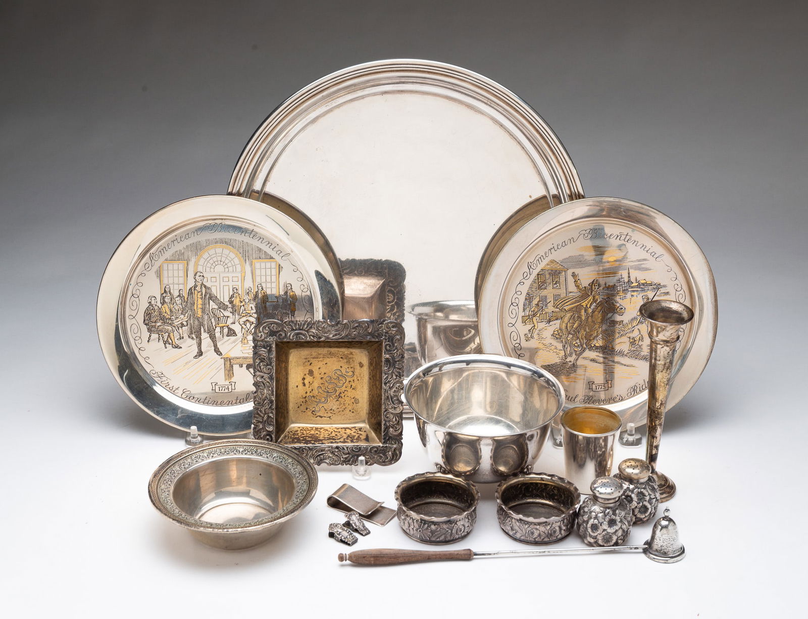 GROUP OF ASSORTED STERLING SILVER. Largest, 12"d.: American, 20th Century. Includes an International Silver "Lord Saybrook" round tray, two Danbury Mint commemorative plates, a footed bowl, a money clip, two clips, salt and pepper shakers, two decorat