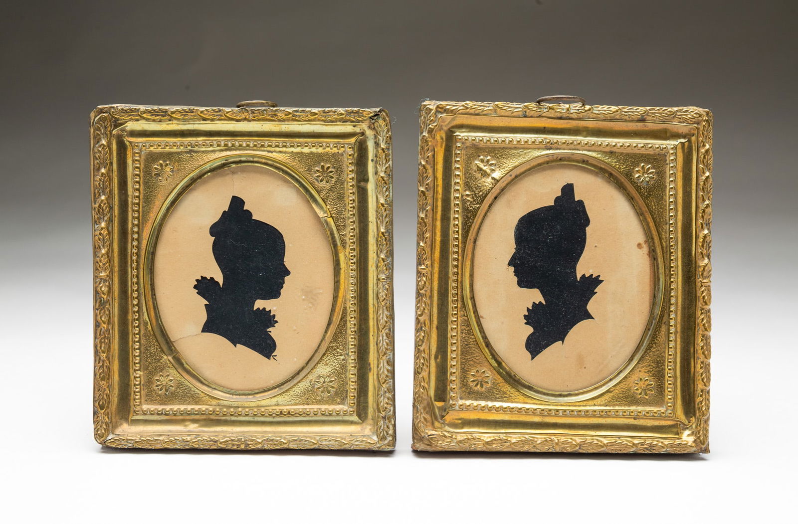 PAIR OF AMERICAN SCHOOL HOLLOW-CUT SILHOUETTES OF LADIES. Frame, 5.25"h. 4.5"w. (1 of 4)
