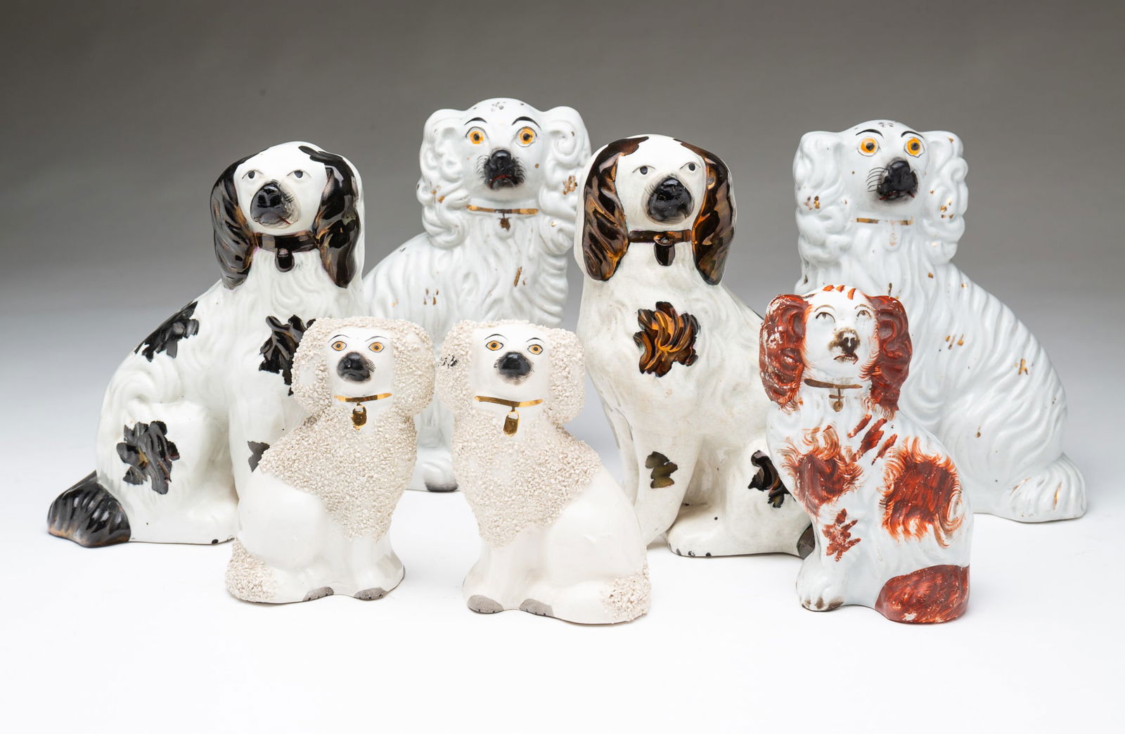SEVEN STAFFORDSHIRE SEATED DOGS. Largest, 7.5"h. and 7"h. (1 of 7)