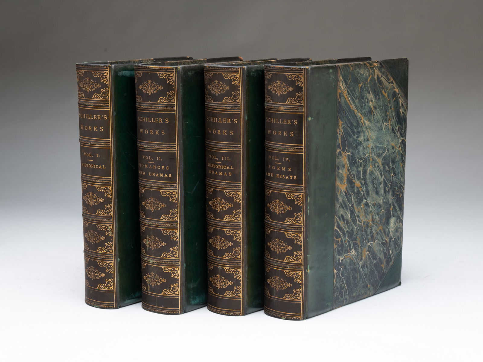 THE WORKS OF FREDERICK SCHILLER IN FOUR VOLUMES.: American. Copyright, 1884. Published by S.E. Cassino and Co., Boston. Leather-bound books with marbled covers and gilt writing on the spines. One book 7.5"h. SHIPPING: All purchases from Amelia