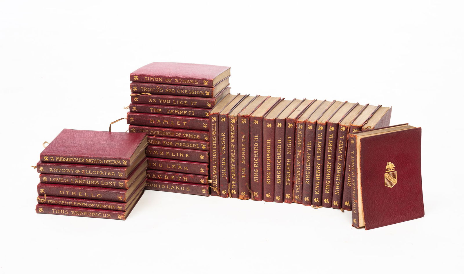 THE TEMPLE SHAKESPEARE IN THIRTY-THREE VOLUMES. Overall, 9"h. 8"w. 13"d. One book, 5.25"h. 4"w.: English. Early 20th Century. Published by J.M. Dent & Co., Aldine House. Leather-bound books with gilt titles on the spines.SHIPPING: All purchases from Amelia Jeffers, Auctioneers & Appraisers may be
