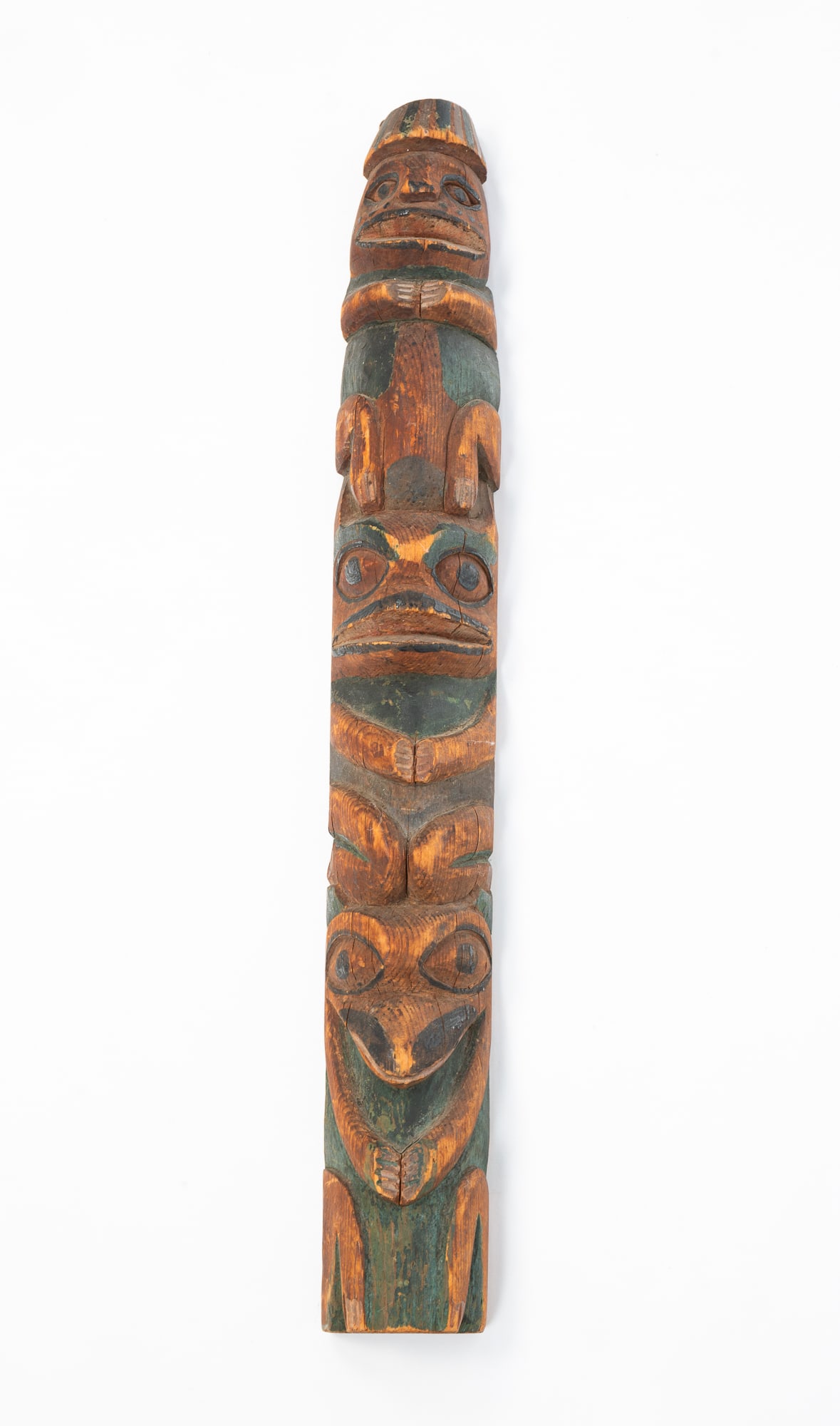 NORTHWEST COAST PAINTED AND CARVED PINE HANGING TOTEM. 23"h. 3"w. (1 of 4)