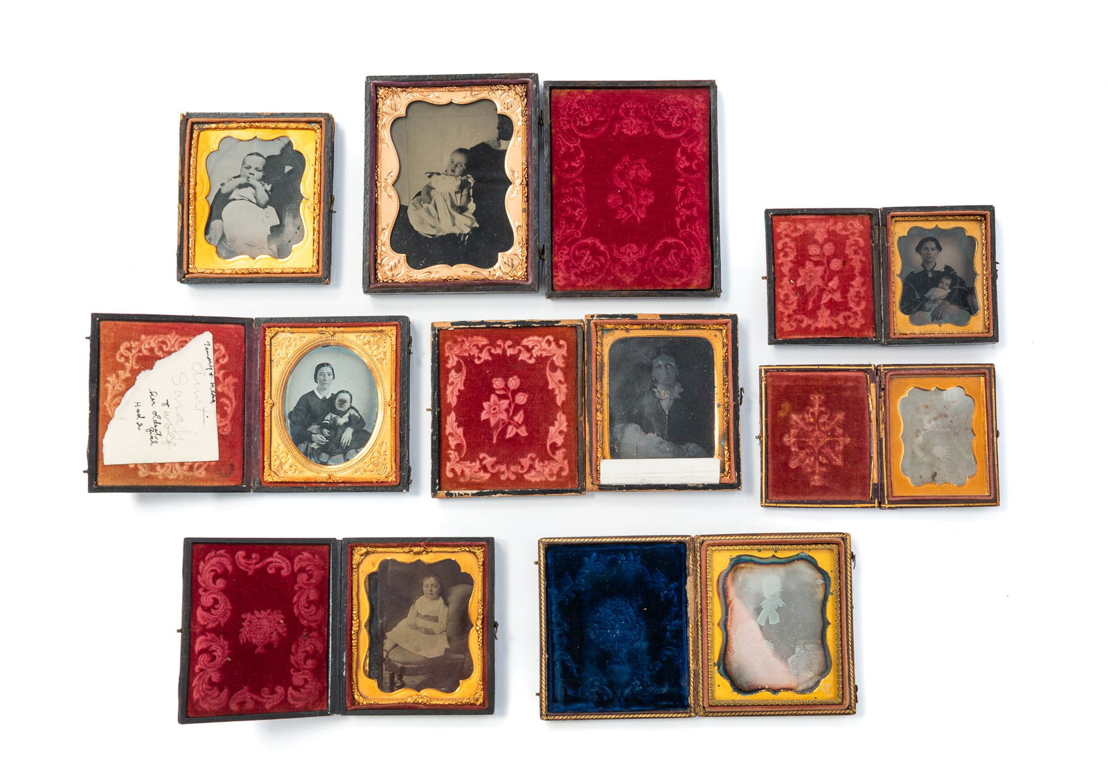 GROUP OF EARLY CASED IMAGES OF PARENTS AND CHILDREN. Largest plate, 4.75"h. 3.75"w. (1 of 7)