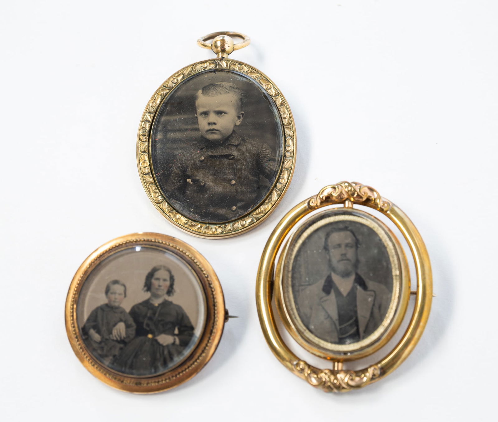 THREE VICTORIAN MOURNING JEWELRY BROOCHES AND PENDANTS. Largest, 2"h. 1.5"w. (1 of 2)
