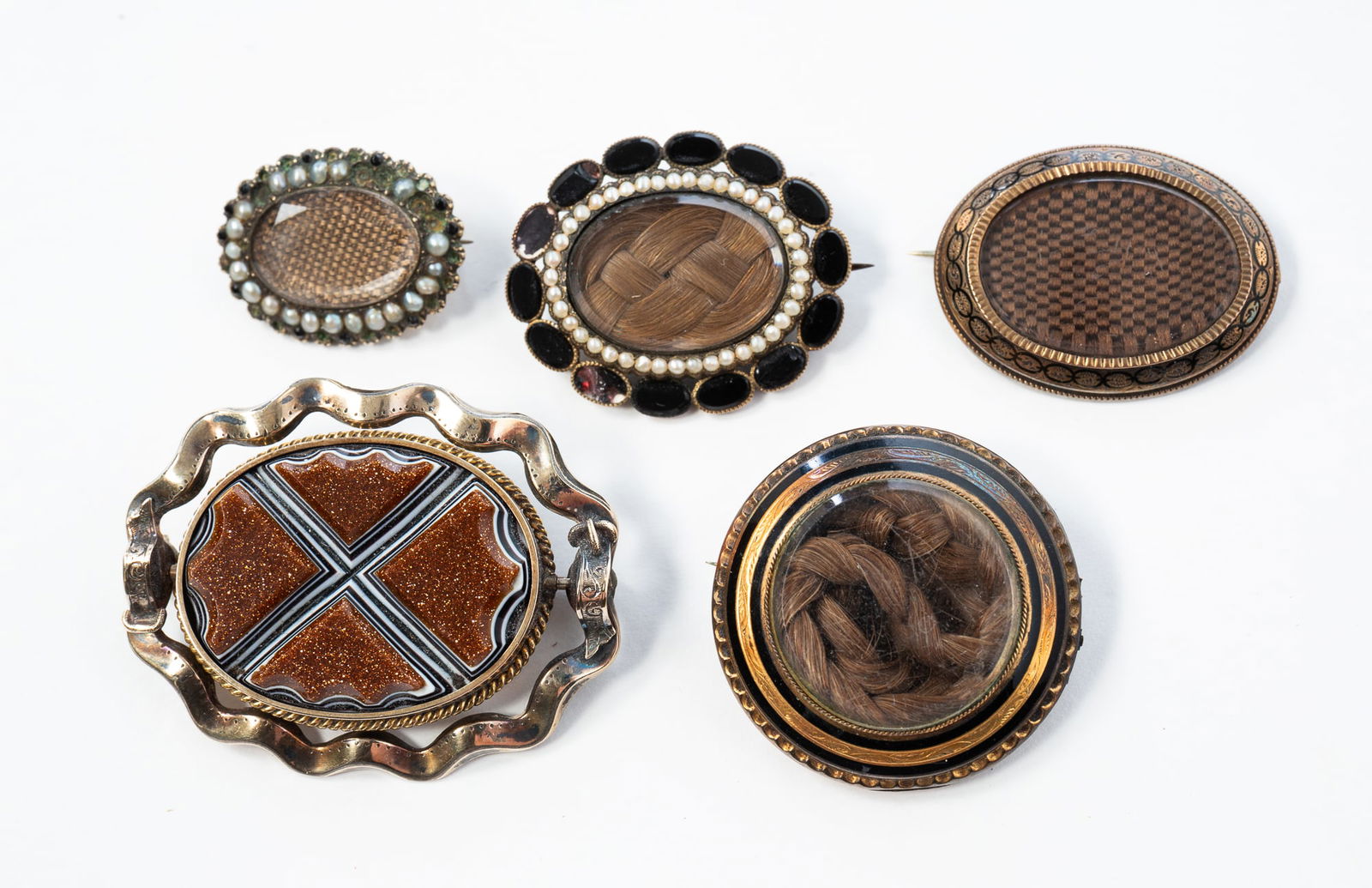 FIVE VICTORIAN WOVEN HAIR-WORK MOURNING JEWELRY BROOCHES. Largest, 2"h. 1.5"w. (1 of 2)