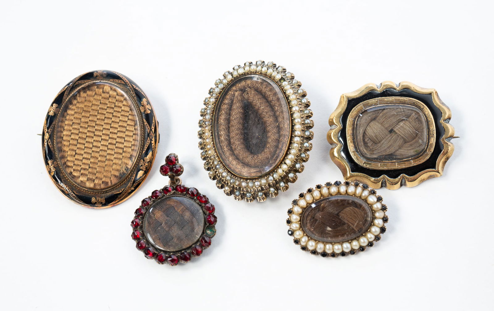 FIVE VICTORIAN WOVEN HAIR-WORK MOURNING JEWELRY BROOCHES. Largest, 1.5"h. 1.25"w. (1 of 2)
