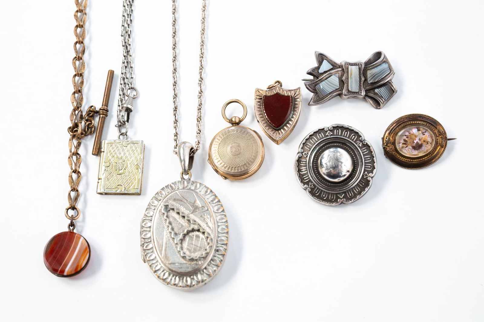 GROUP OF VICTORIAN JEWELRY, INCL. A MOURNING LOCKET. Locket pendant necklace, 23.5"l. (1 of 2)