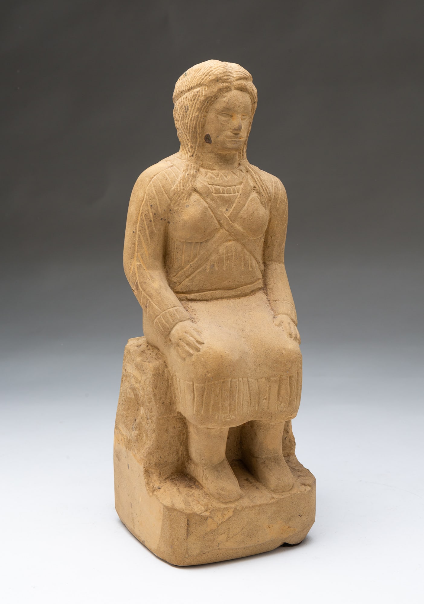 ERNEST "POPEYE" REED (OHIO, 1919-1985) FOLK ART CARVED STONE DIMINUTIVE SCULPTURE OF A SEATED NATIVE (1 of 7)