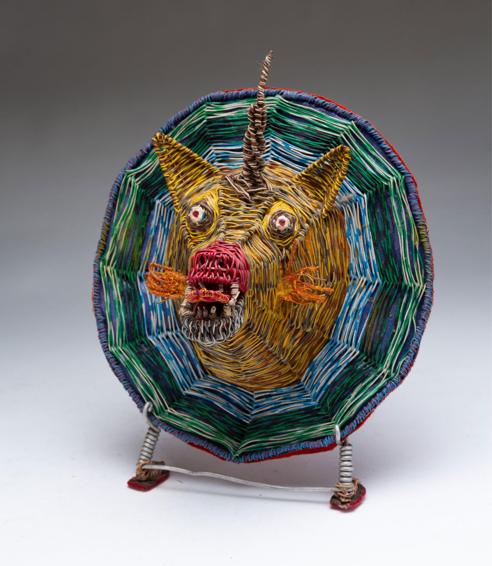 W.D. "CRAZY MAC" MCCAFFREY (AKRON, OHIO, 1923 - 1993) OUTSIDER ART COLORED WIRE RHINO HEAD PLAQUE. (1 of 4)