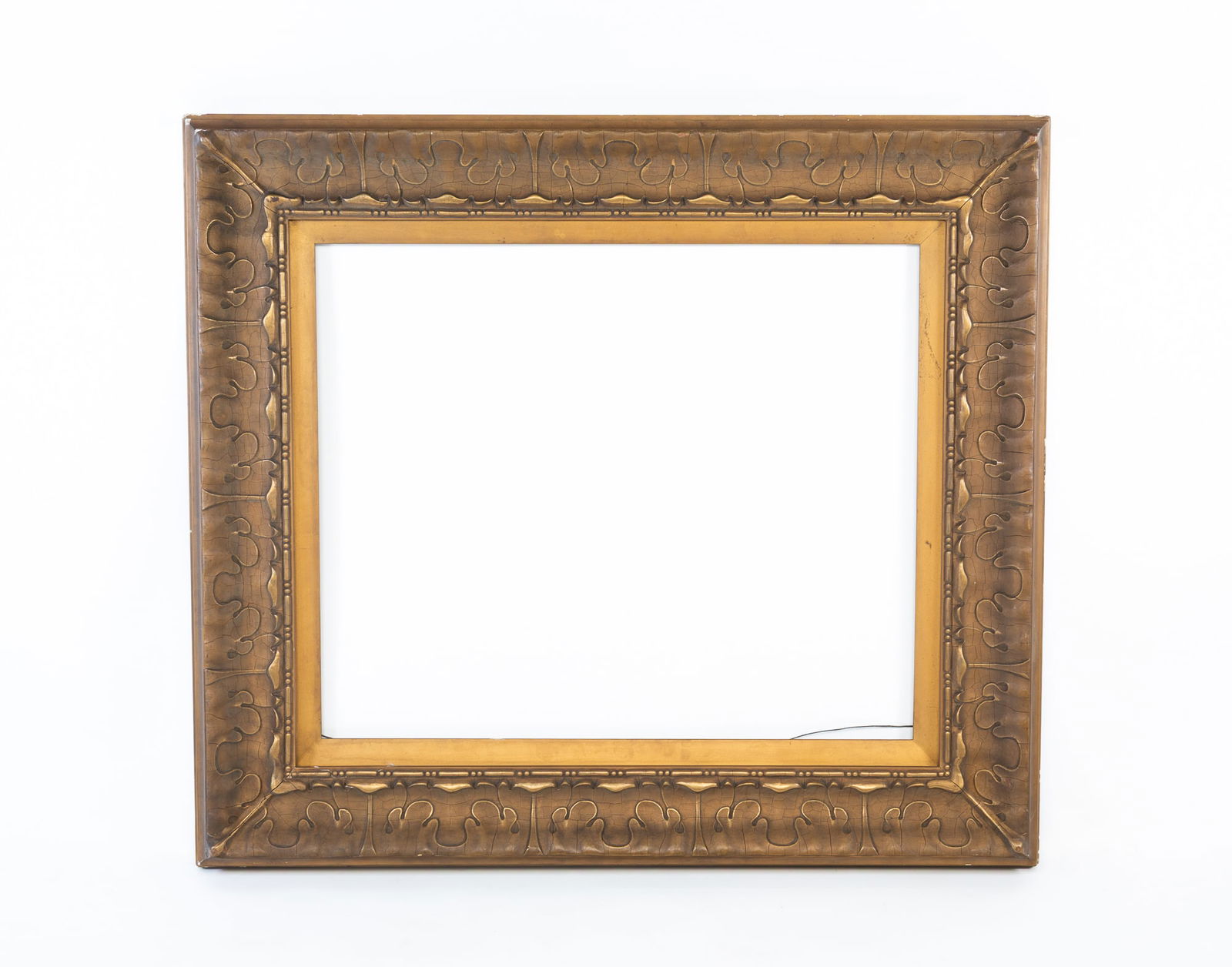 LARGE GILTWOOD AND COMPOSITION LEAF-MOLDED PICTURE FRAME. Overall, 37"h. 42"w. (1 of 3)