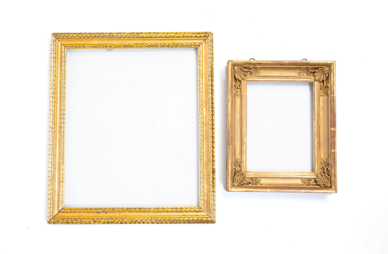 TWO GILTWOOD AND COMPOSITION PICTURE FRAMES. The larger, overall, 18"h. 15"w. (1 of 4)
