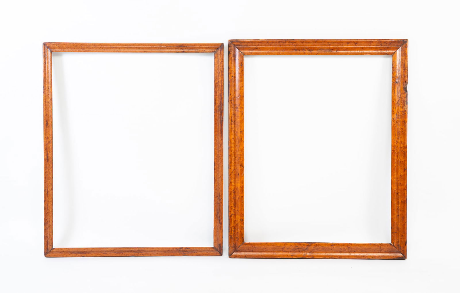 TWO BIRD'S-EYE MAPLE PICTURE FRAMES. The larger, overall, 32.25"h. 26.25"w. (1 of 3)