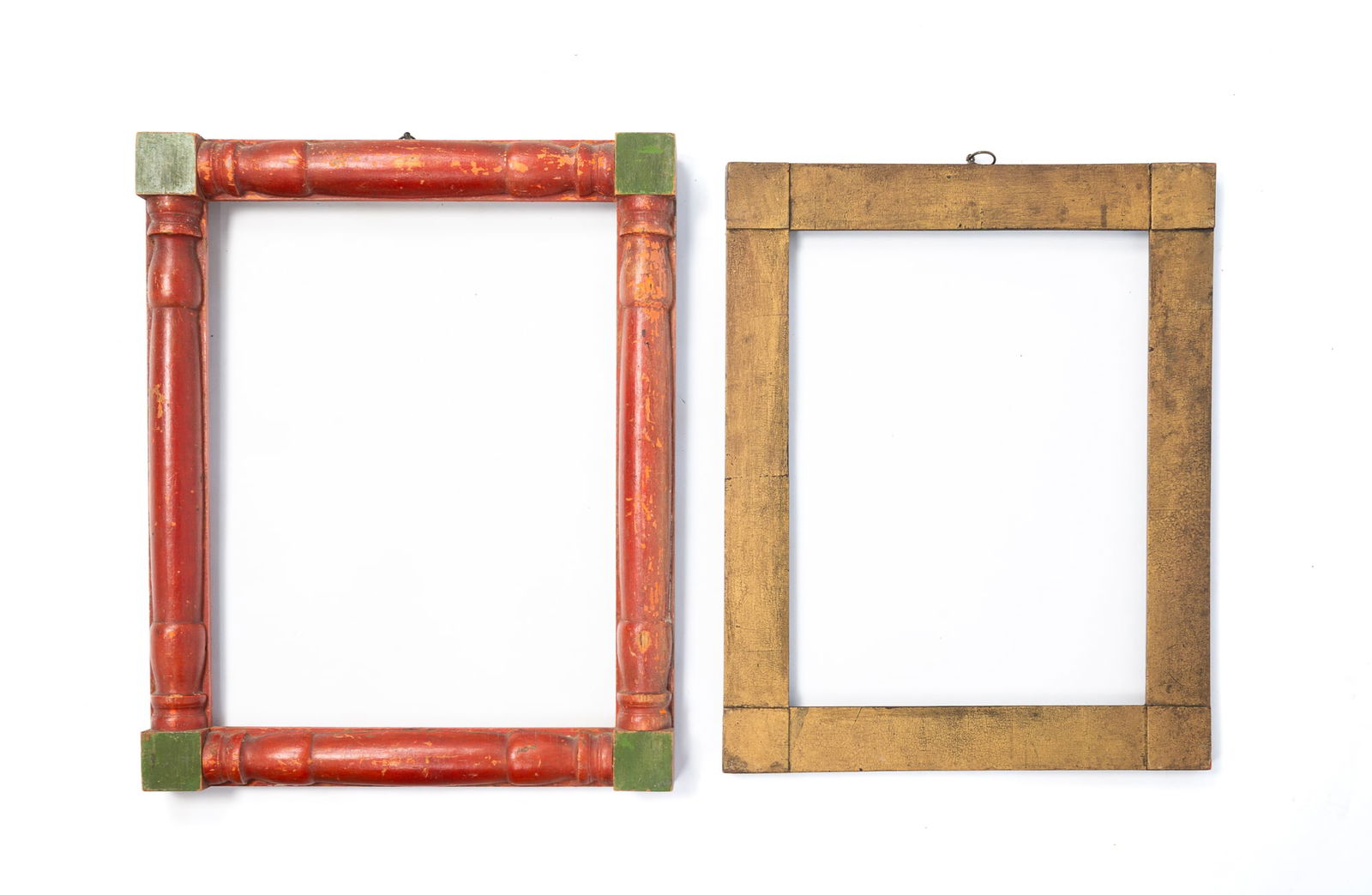 TWO PAINTED PICTURE FRAMES WITH CORNER BLOCKS. The larger, overall, 16.75"h. 13.75"w.: American, 19th Century. Frame with brick red-painted turned half-pilasters and green-painted corner blocks, pegged bridle joints, and a brass hanging loop on top. Rabbet, 14"h. 11.25"w. Overall, 16.75