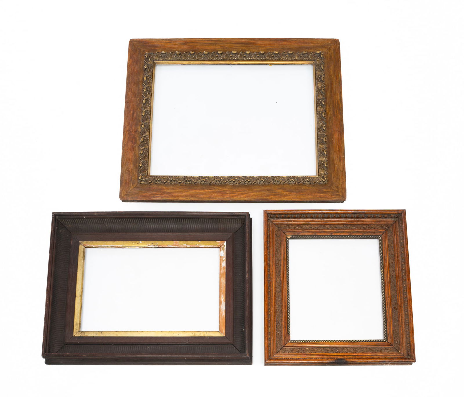 THREE CARVED WOOD AND COMPOSITION PICTURE FRAMES. Largest, 25"h. 29.5"w. Smallest, 18.25"h. 18.25"w. (1 of 5)