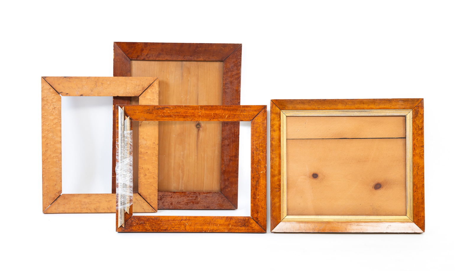 FOUR BIRD'S-EYE MAPLE PICTURE FRAMES. The largest, overall, 20.75"h. 18.25"w. The smallest, overall, (1 of 8)