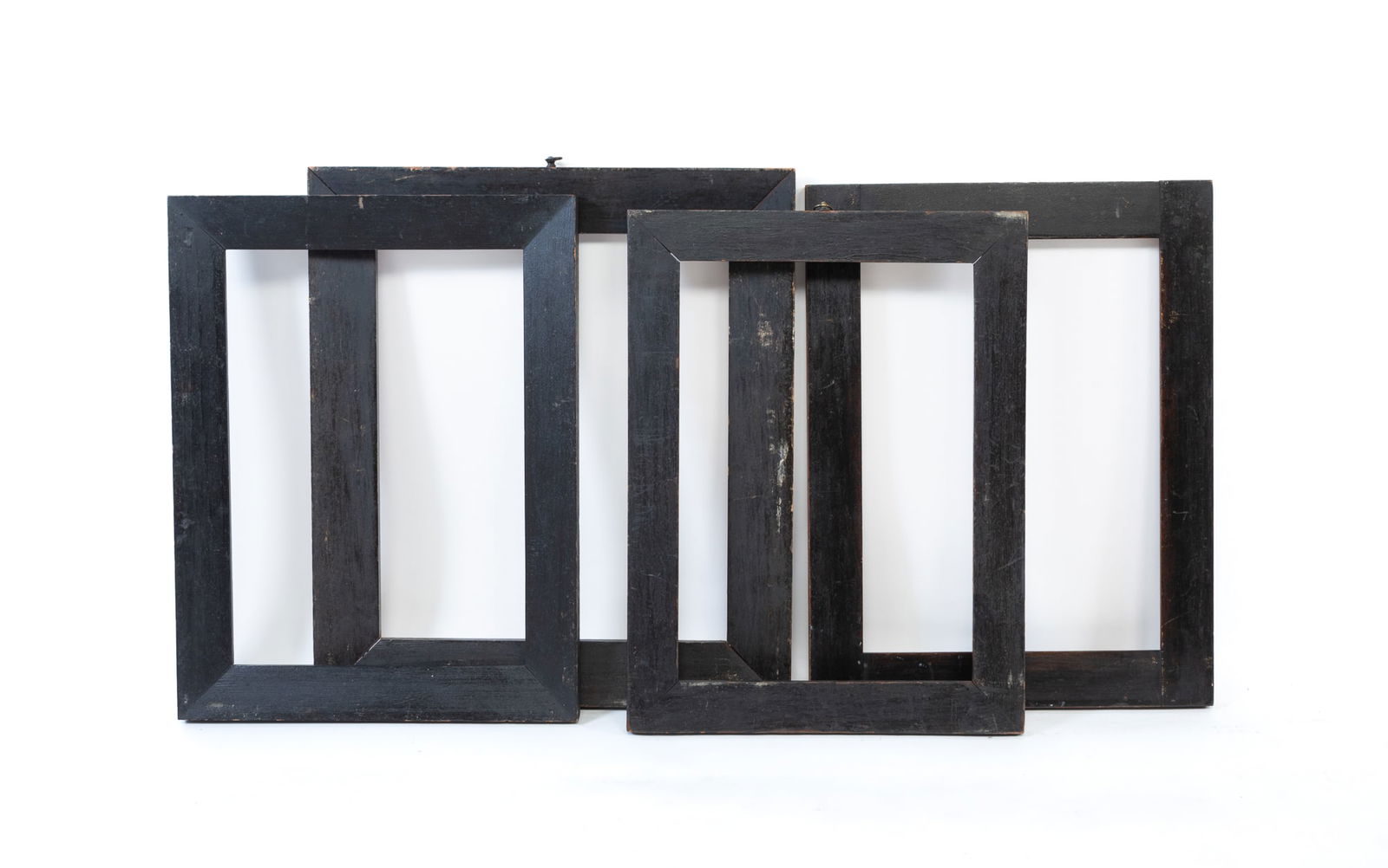 FOUR EBONIZED WOOD PICTURE FRAMES. Largest, overall, 17.75"h. 16"w. Smallest, overall, 16.75"h. (1 of 3)