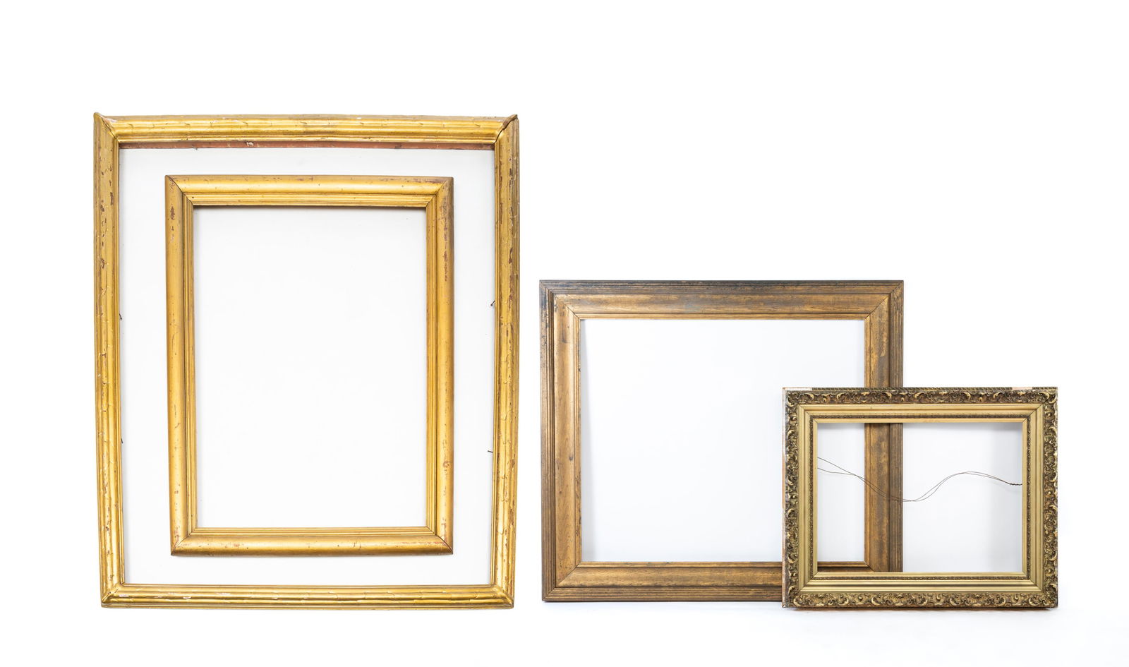 FOUR LARGE GILTWOOD AND COMPOSITION PICTURE FRAMES. Largest overall, 46.5"h. 55"w. (1 of 10)