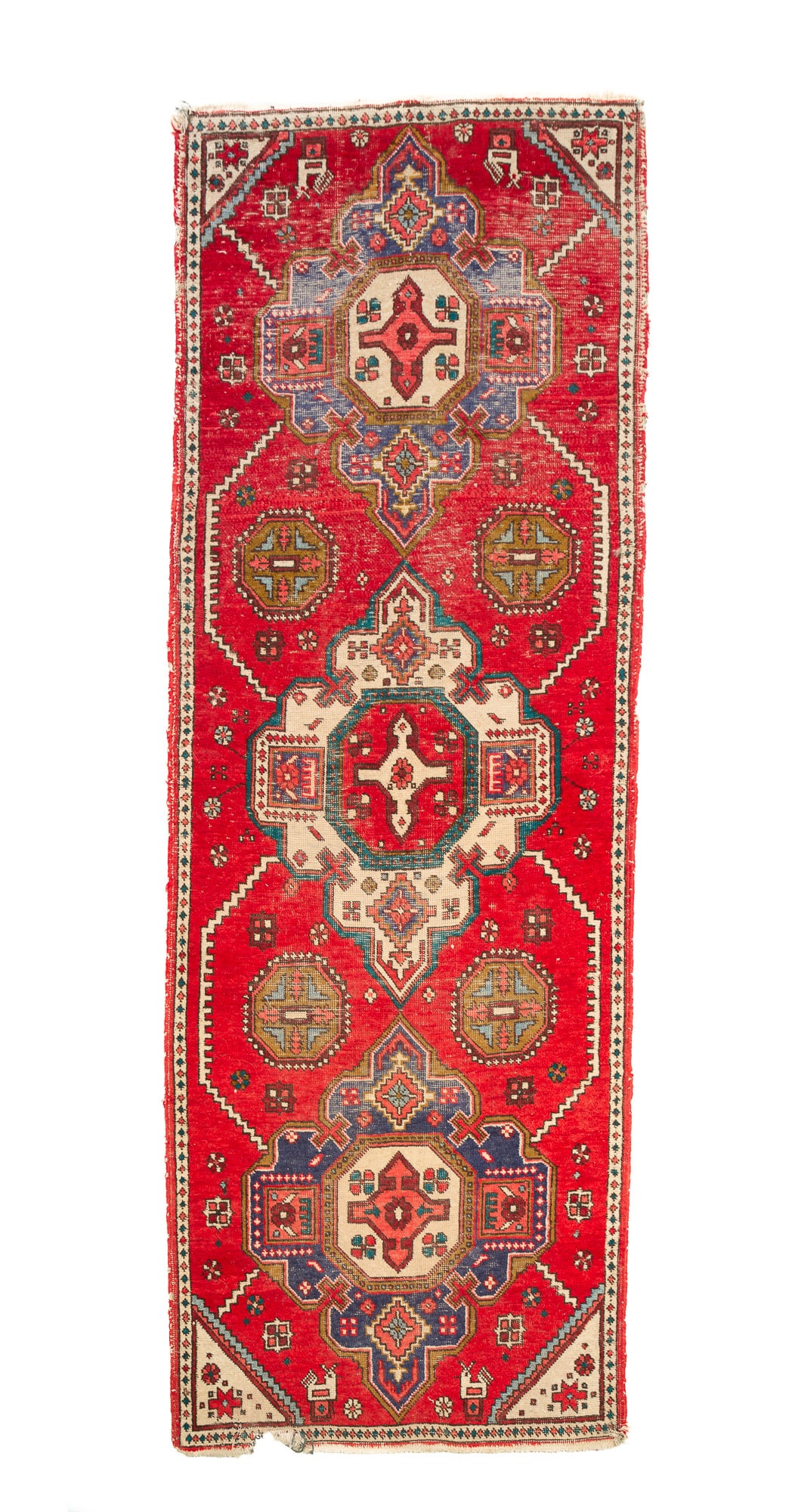 PERSIAN KAZAK WOOL RUNNER. 33"w. 88"l.: Iran, Early 20th Century. Hand-knotted. Having three medallions on a red field with geometric designs interspersed with green octagons, cream spandrels with stylized flowers, and a diamond border, in