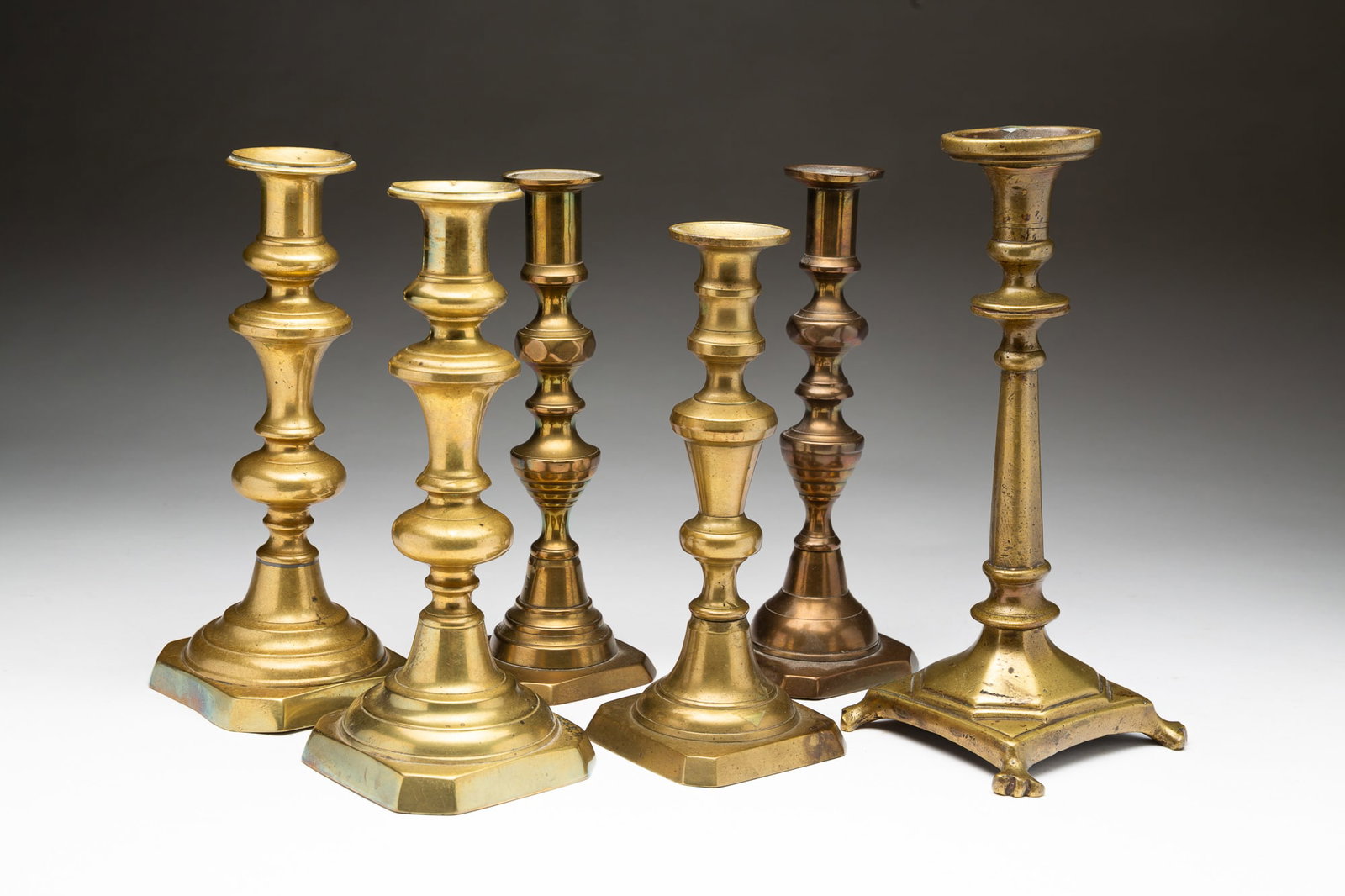 SIX BRASS CANDLESTICKS. (1 of 8)