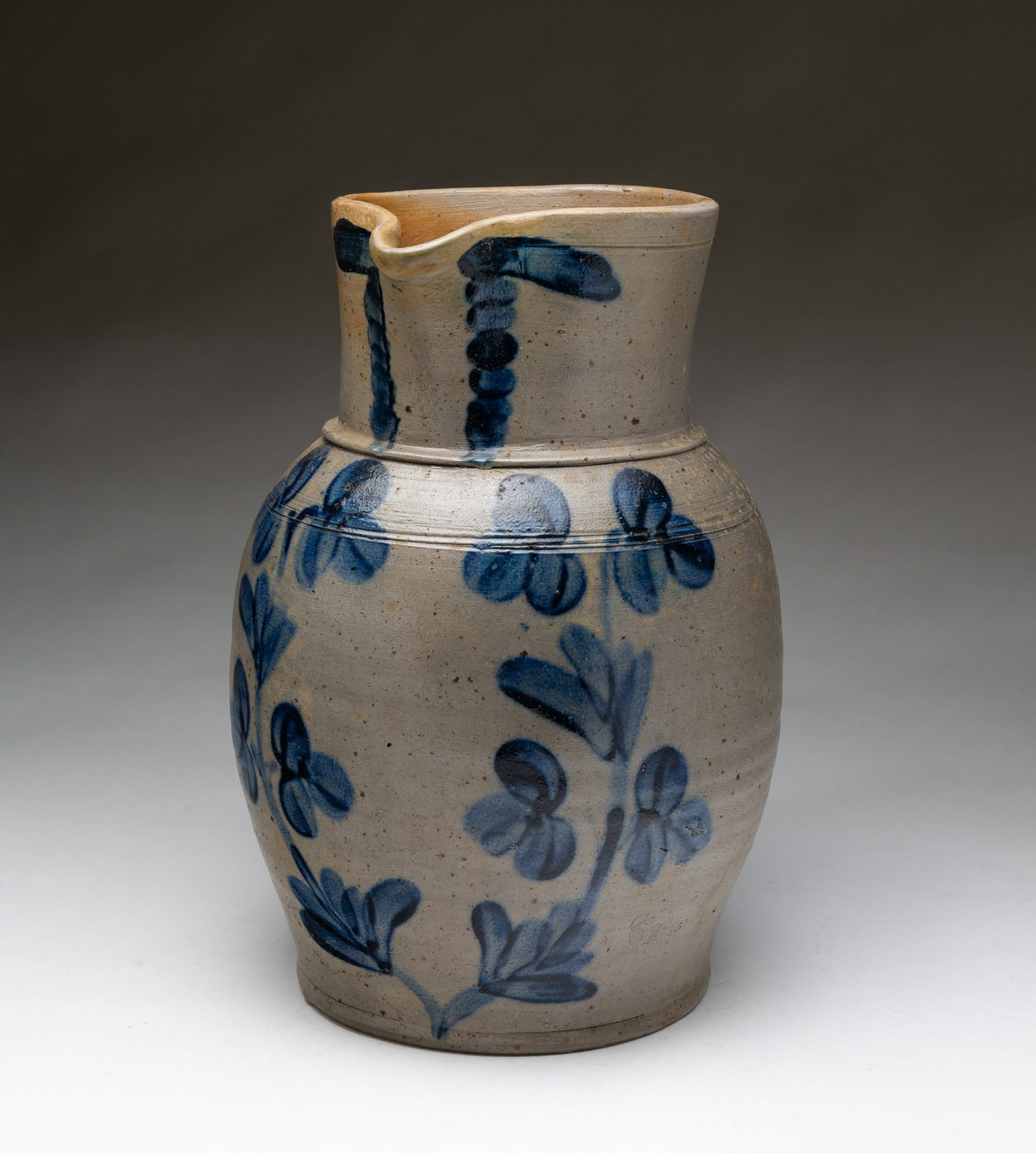 AMERICAN COBALT-DECORATED STONEWARE ONE-GALLON PITCHER ATTRIBUTED TO BALTIMORE, MARYLAND. (1 of 6)