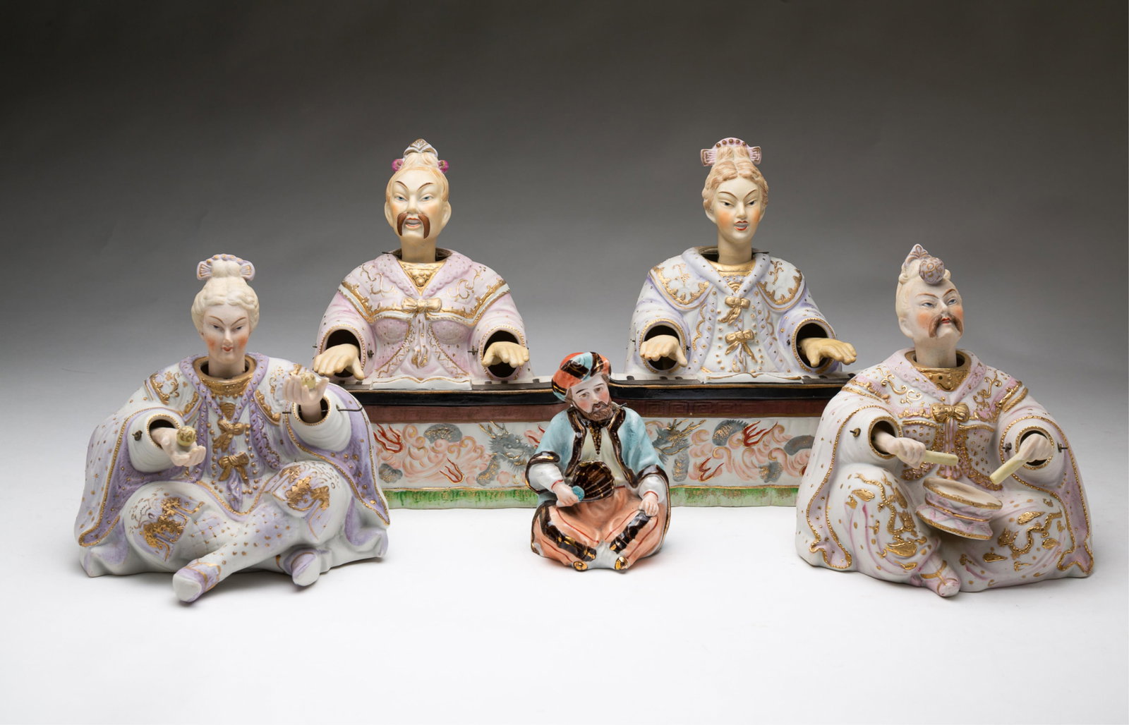FIVE BISQUE PORCELAIN NODDERS.: Late 19th-20th Century. Four are Japanese Ardalt; one pair is a man and woman in heavy robes, she appears to be juggling, and he plays a drum, 6.5"h. and 7"h. Together with a man and woman at keyboard