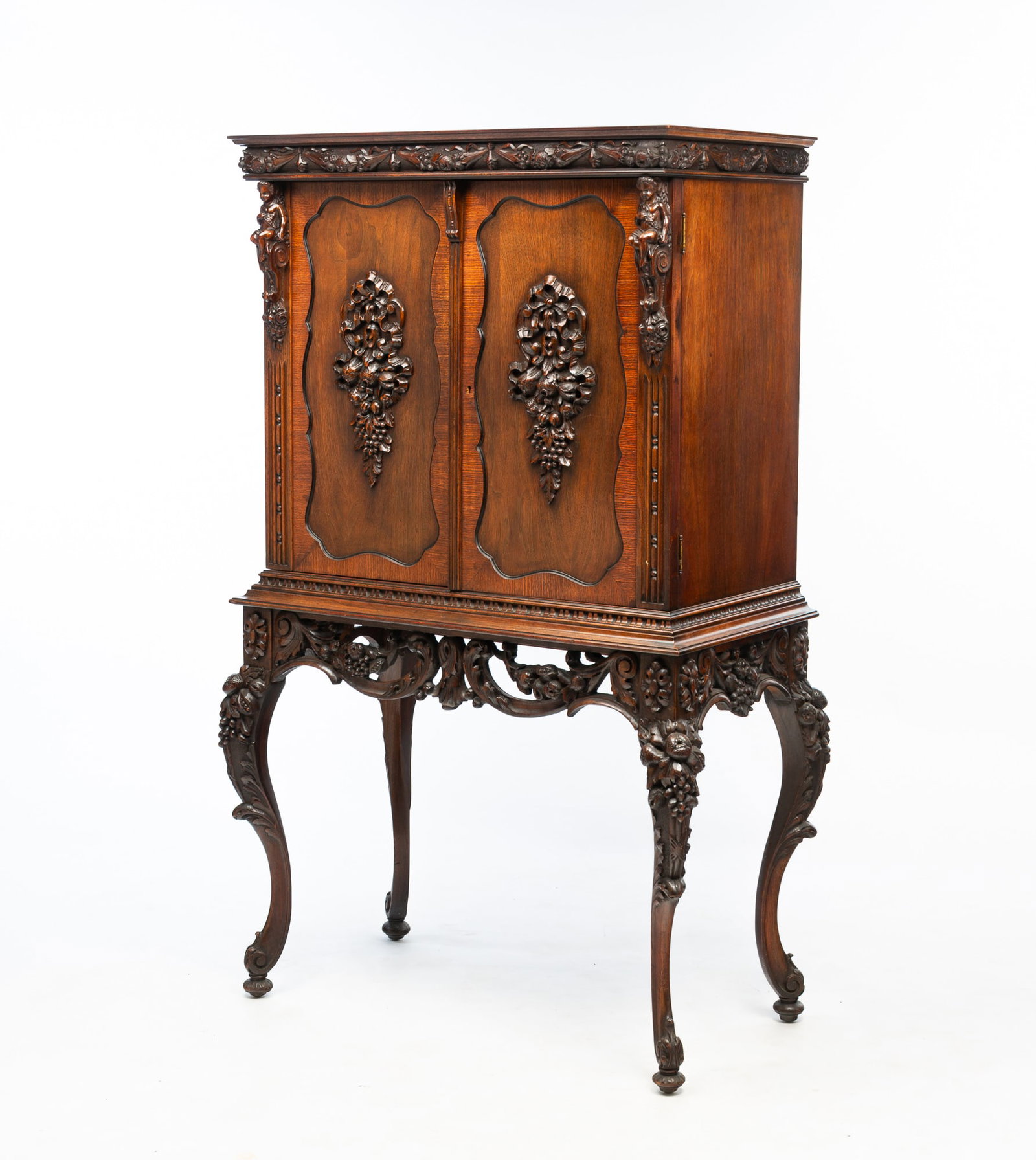 AMERICAN HEAVILY-CARVED MAHOGANY PIANO ROLL CABINET. (1 of 7)