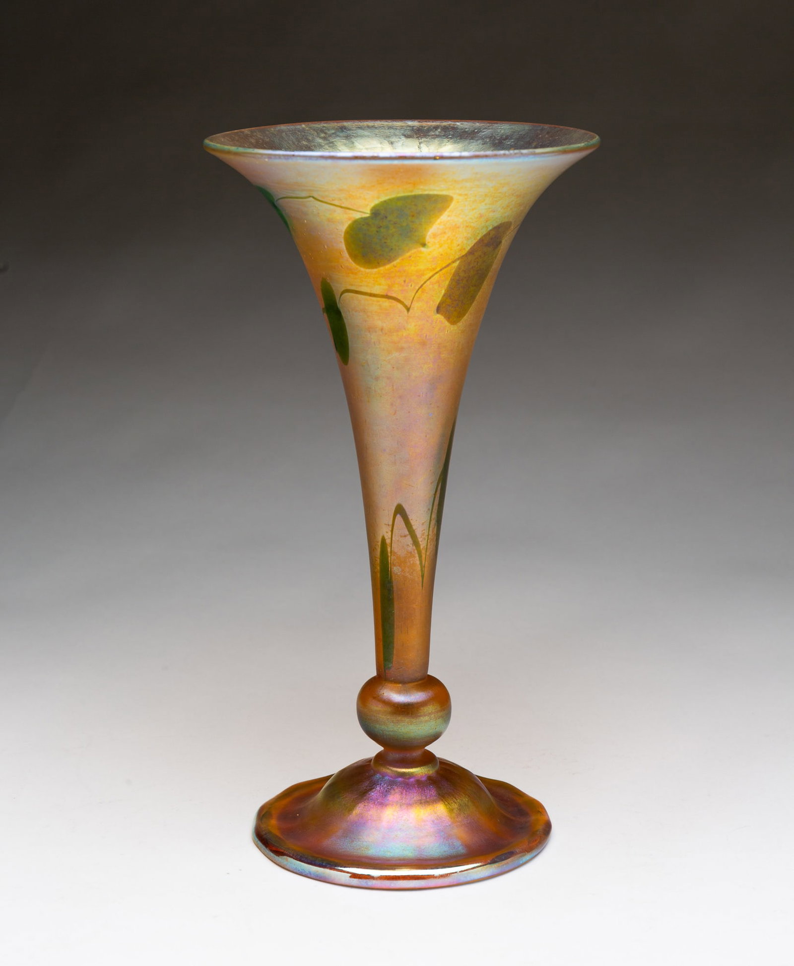 LOUIS COMFORT TIFFANY (NEW YORK, NEW YORK, 1848-1923) FAVRILE GLASS "LEAF AND VINE" TRUMPET VASE. (1 of 4)