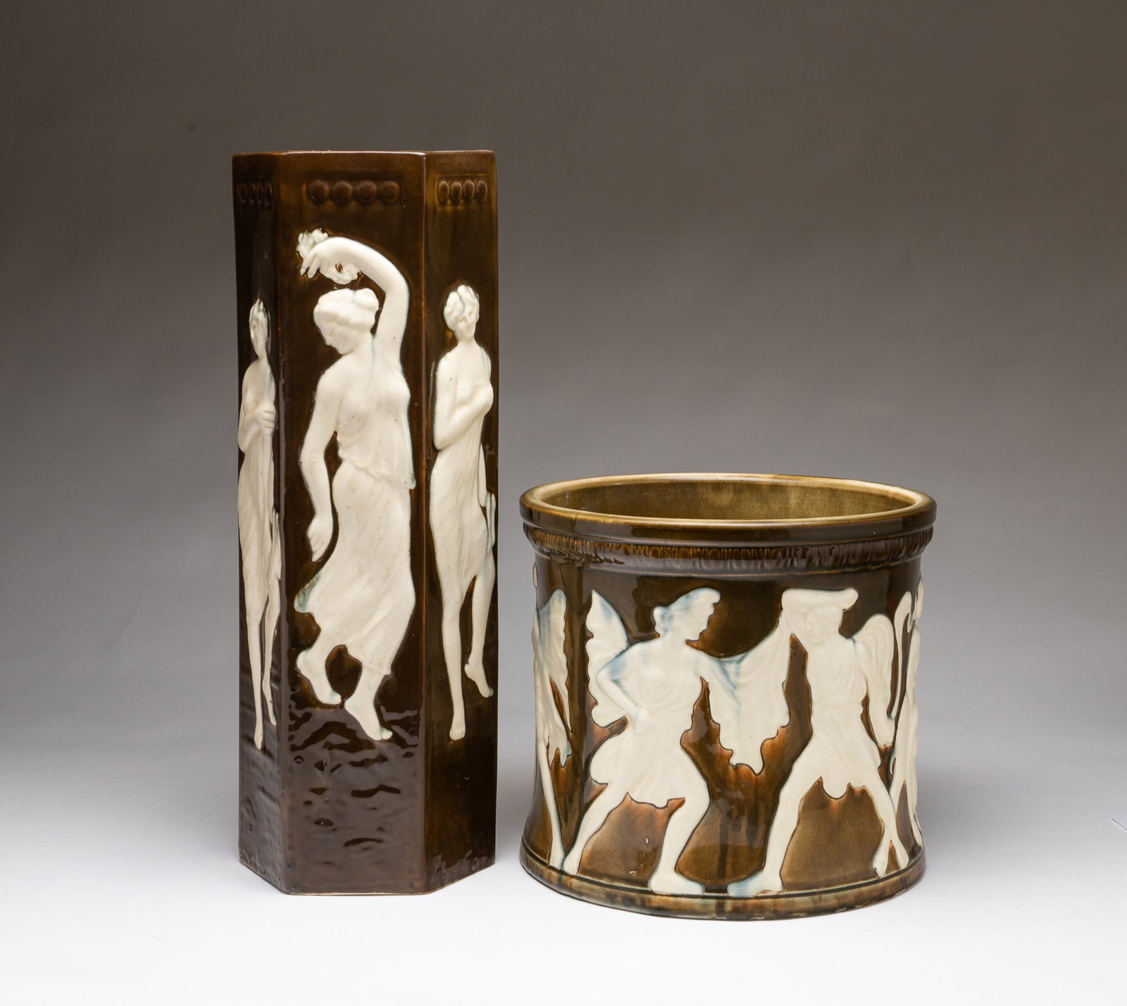 TWO WELLER (OHIO) ART POTTERY GLAZED VESSELS.: American, 20th Century. A tall octagonal vase decorated with Grecian ladies, and the other in short planter form, decorated with Grecian scenes. Both with stamps on bottom. Largest, 17.25"h.