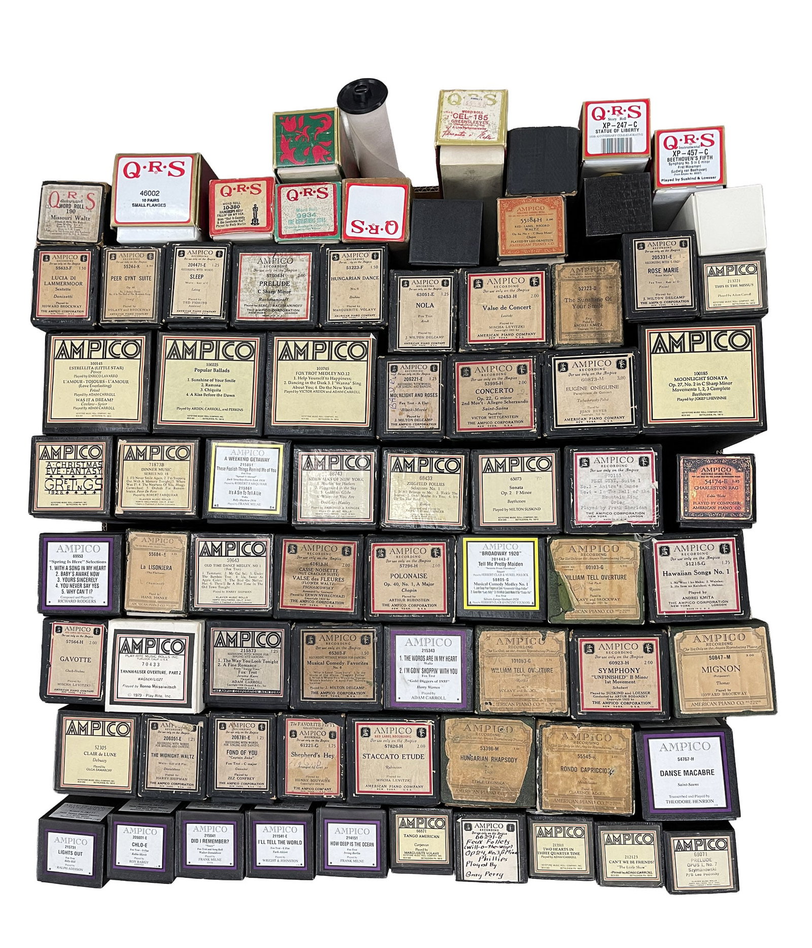 LARGE COLLECTION OF REPRODUCING PIANO ROLLS.: 20th Century. Mostly Ampico with some QRS rolls. Classical and popular music. 13.5"h. 24"w. 24"d.