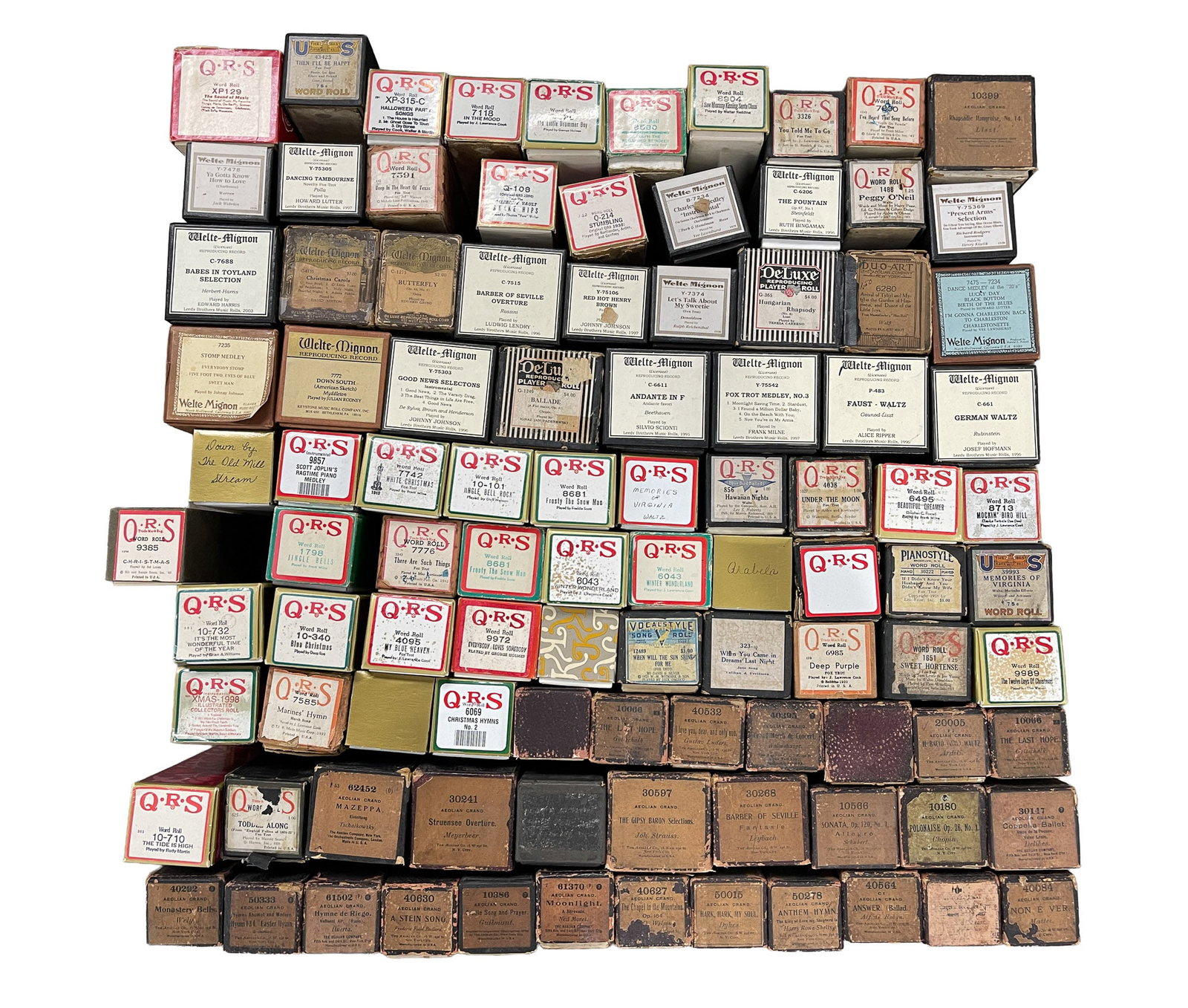 LARGE COLLECTION OF REPRODUCING PIANO ROLLS.: 20th Century. Mostly QRS with some Aeolian Grand in Classical and popular music. 13.5"h. 24"w. 24"d.