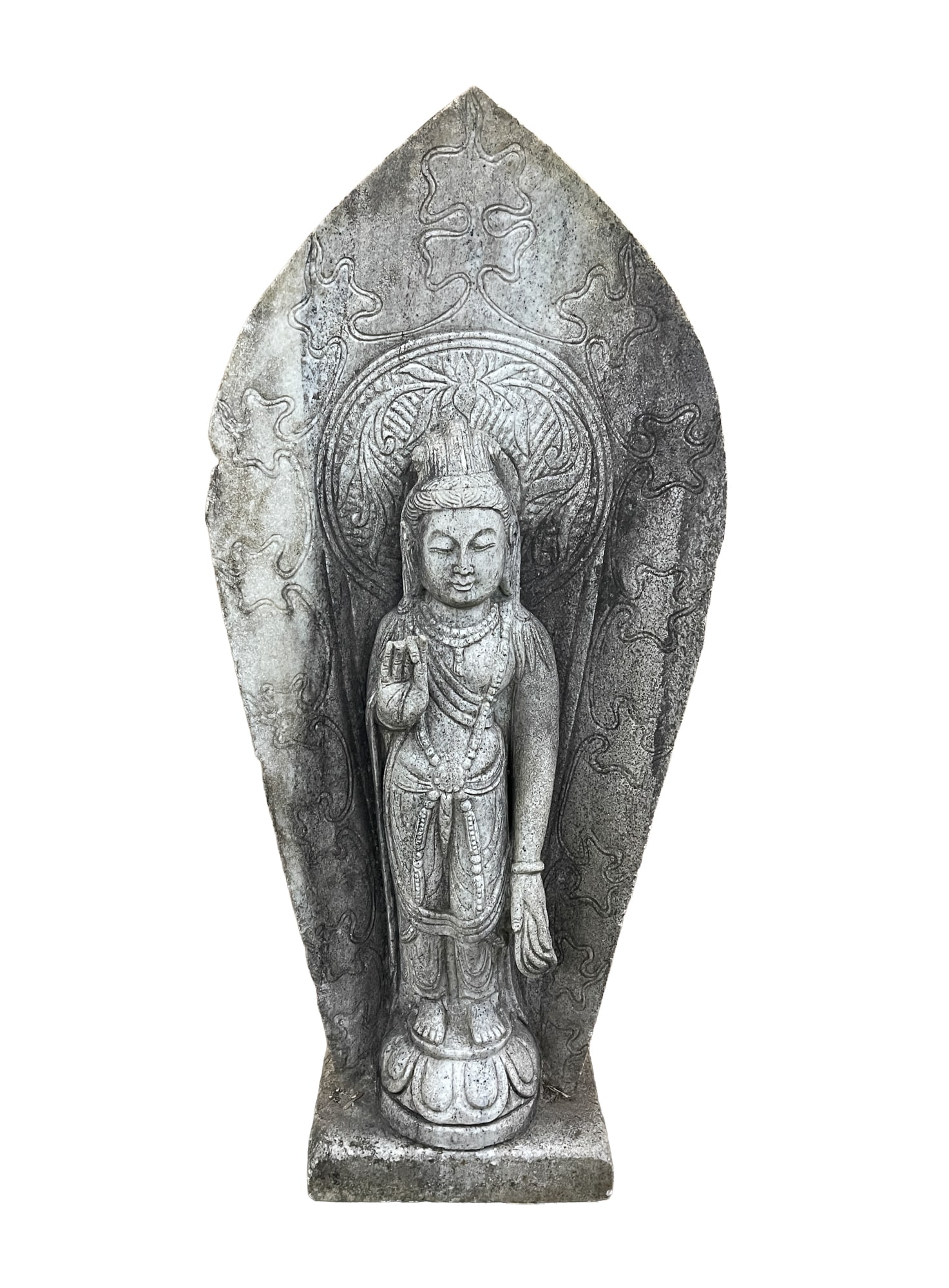 ASIAN STONE BUDDHA STATUE.: Likely Indonesian, Early 20th Century. Stone stele carved with floral and foliate motifs, the Buddha dressed in robes and beads with right hand raised in a mudra and standing on a lotus base. 48"h.