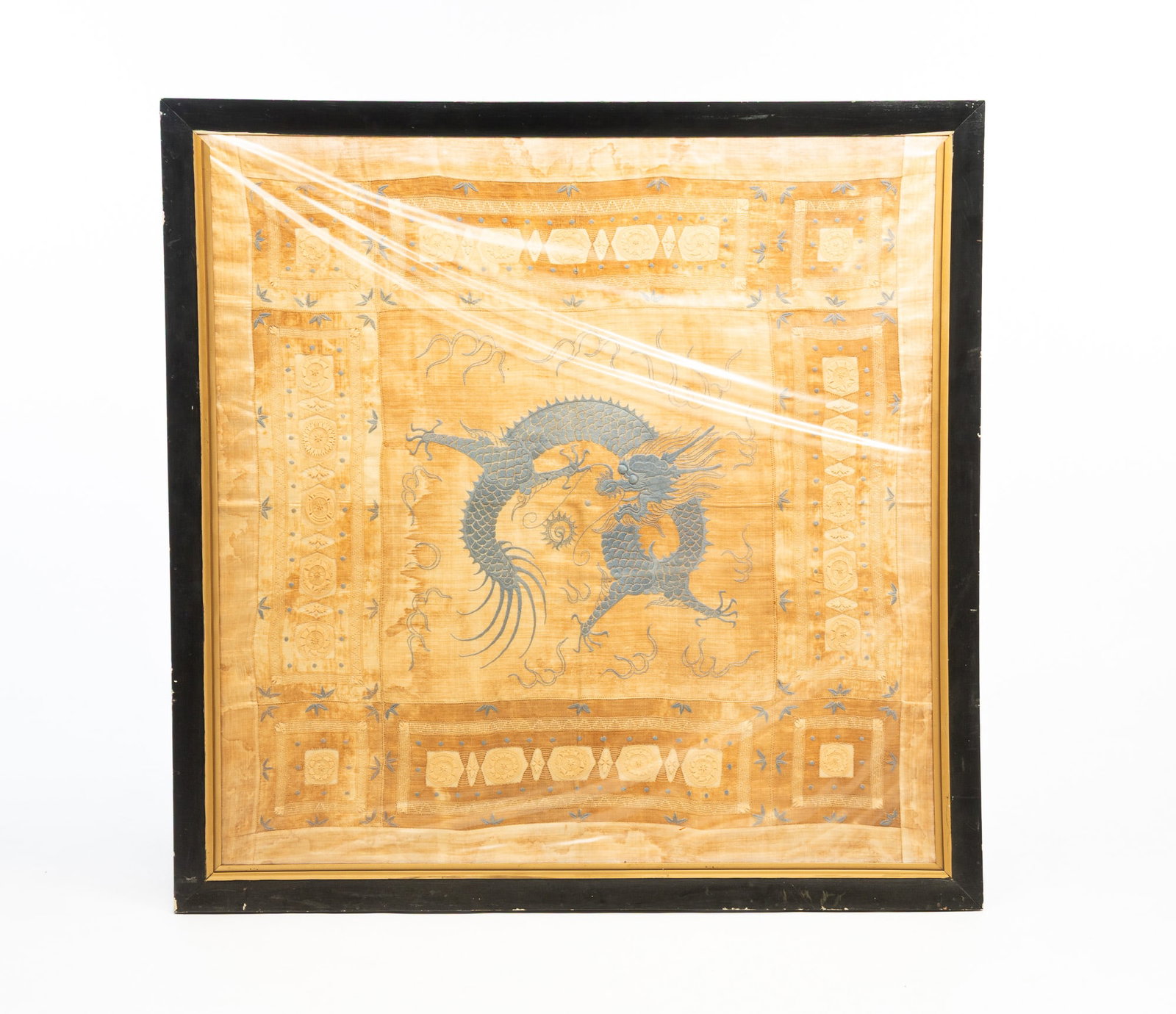 LARGE ASIAN SILK TAPESTRY.: LARGE ASIAN SILK TAPESTRY. 20th Century. A large square of silk with a blue embroidered dragon to center and needlework around the sides. 46.5" square. Provenance: From the late George Shahady (Bridge