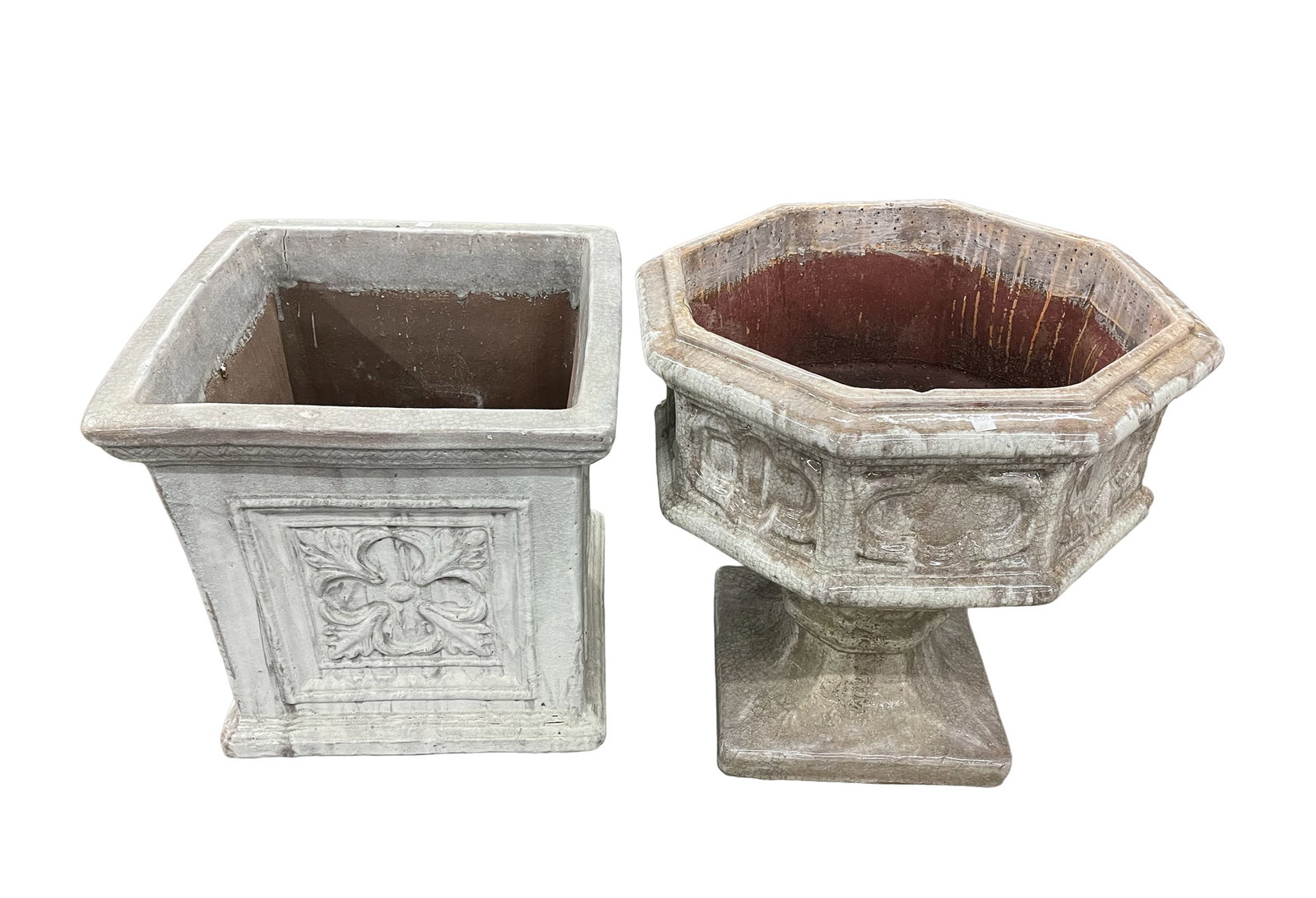 TWO GLAZED TERRACOTTA GARDEN PLANTERS.: Contemporary. Both have mottled gray and white glaze. One is octagonal with embossed panels, knob stem, and square foot. 24"h. 23.5" square, the second, nearly a cube, flared rim, and foot with emboss
