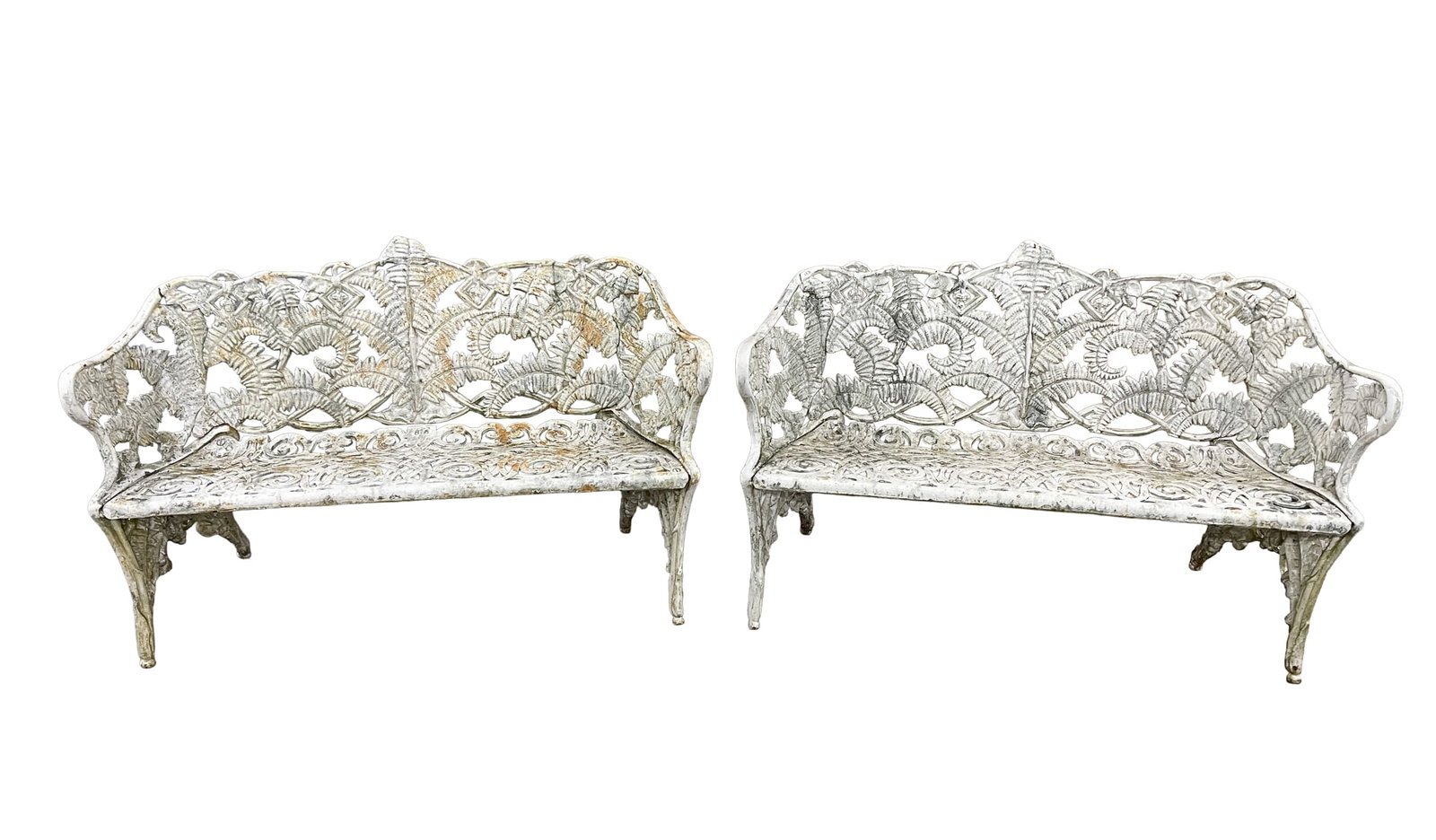 PAIR OF AMERICAN CAST IRON GARDEN BENCHES.: American, late 19th Century. Fern-pattern backs, back with rounded ends, open work seat and old white paint. Each, 33.5"h. 16" seat h. 55"w. 18"d.Provenance: From the late George Shahady (Bridgeport,