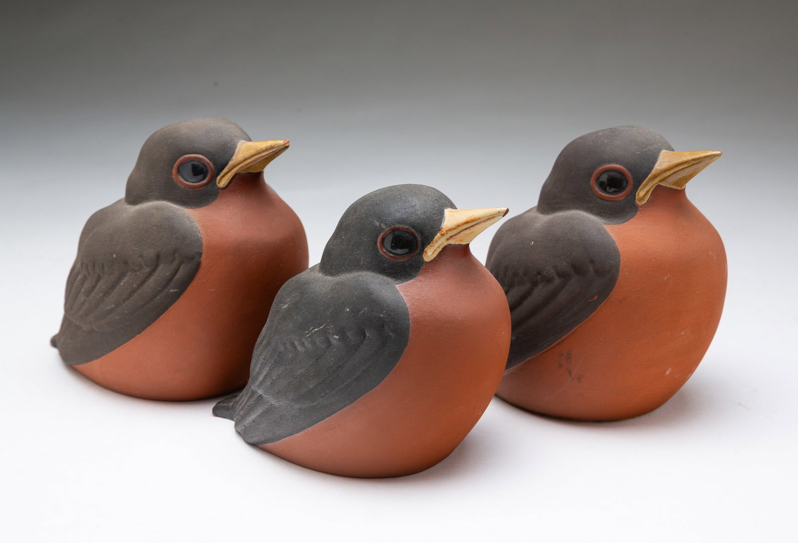 THREE CHESTER NICODEMUS (OHIO, 1901-1990) GLAZED EARTHENWARE ROBINS. (1 of 4)