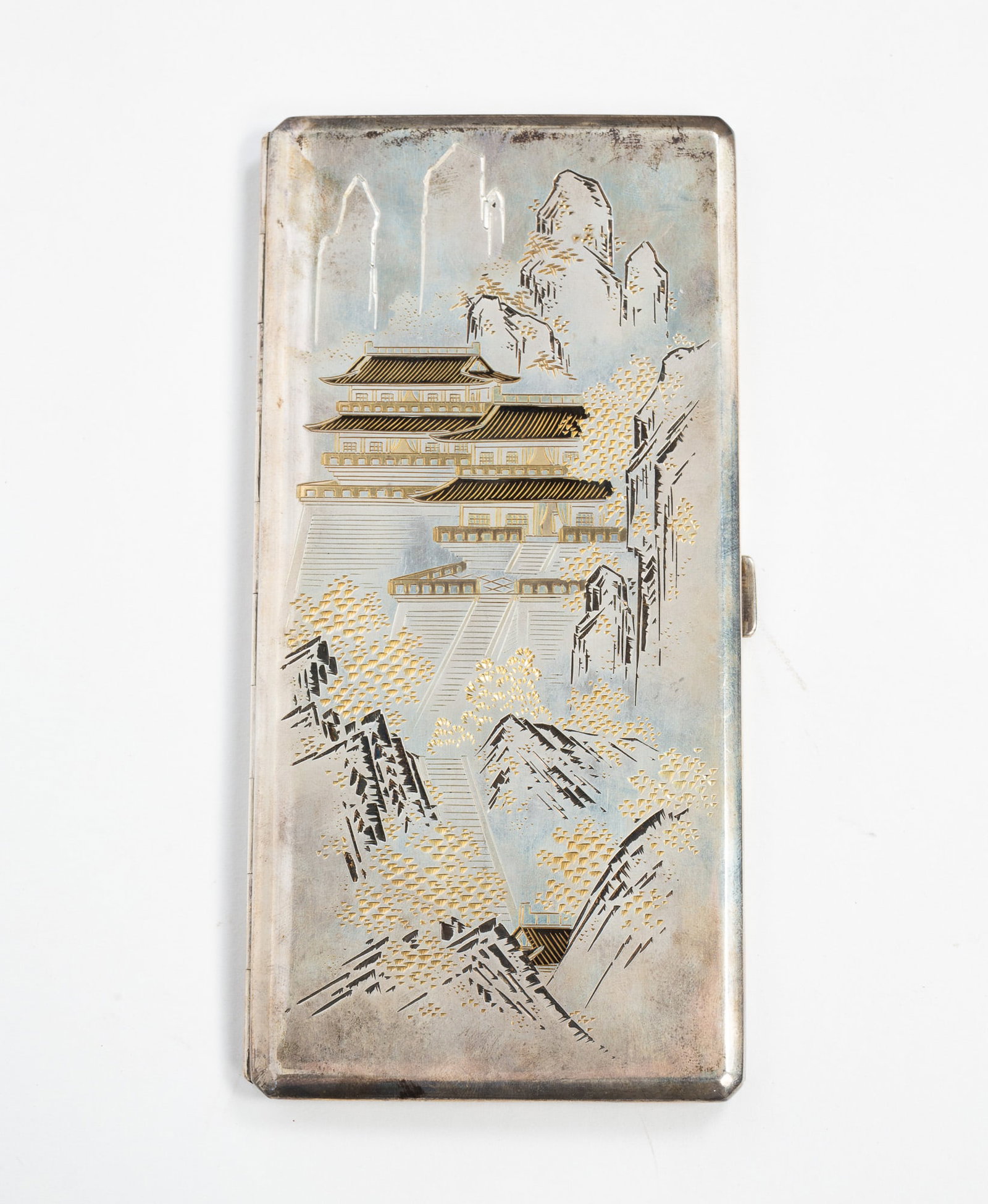 950 SILVER ETCHED CIGARETTE CASE.: 20th Century. Long, rectangular box etched with an Asian landscape scene to the front and continuing to the back. Marked "SILVER 950" to interior. Approximately 6.4 ozt. 6.75"h. 2.25"w.**Note: