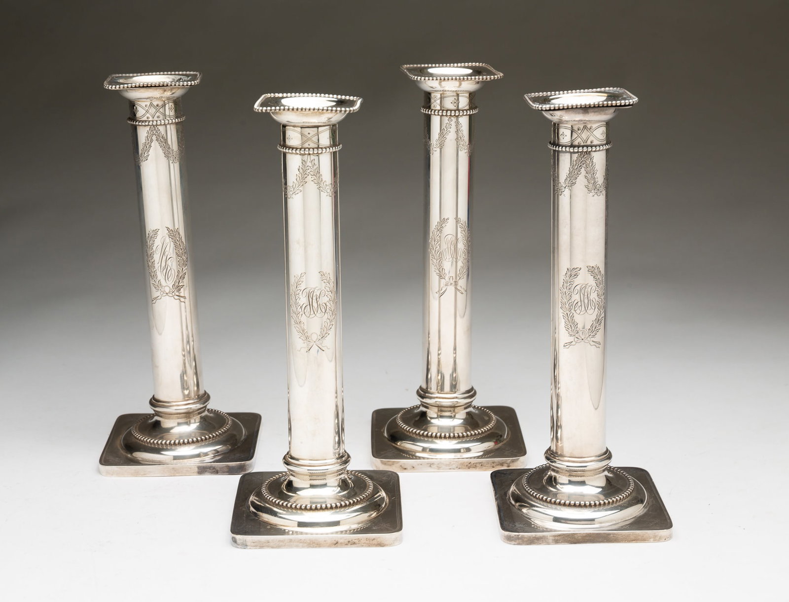 FOUR DURGIN STERLING SILVER CANDELSTICKS. (1 of 6)