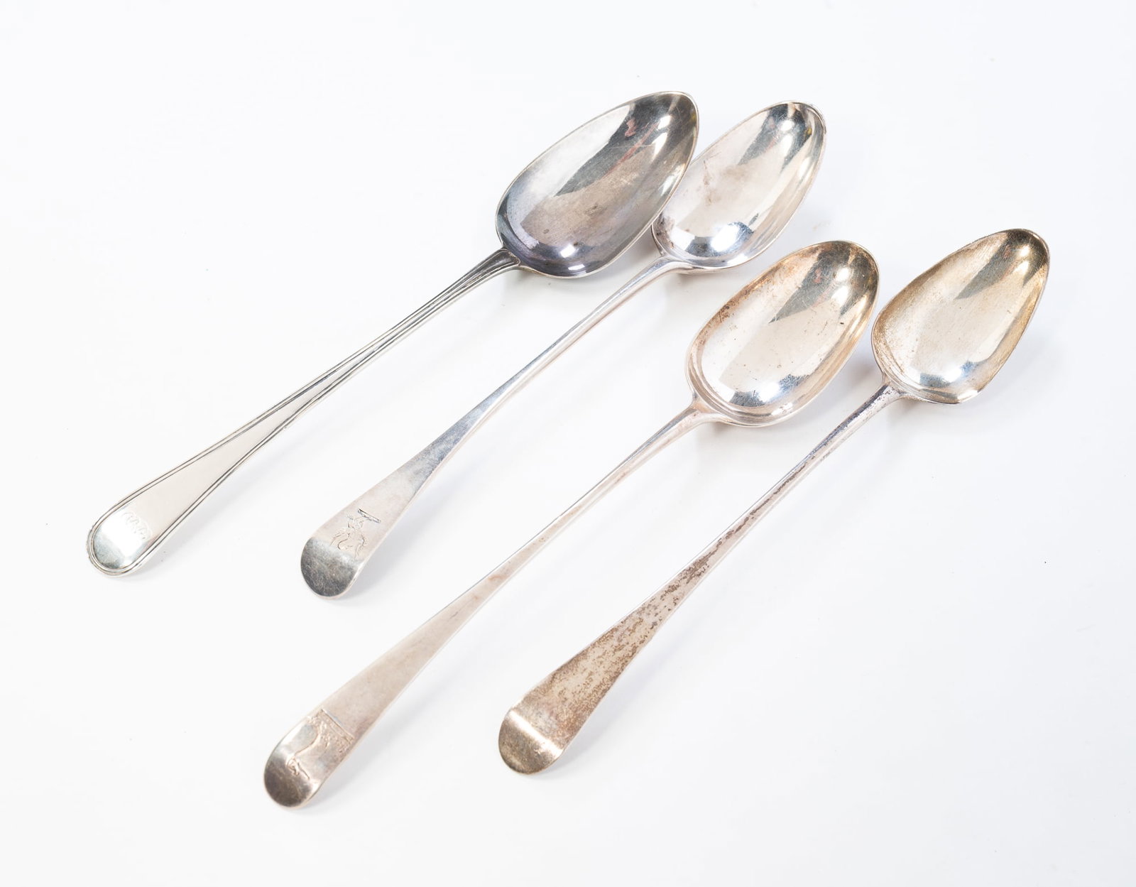FOUR ENGLISH STERLING SILVER SERVING SPOONS. (1 of 6)