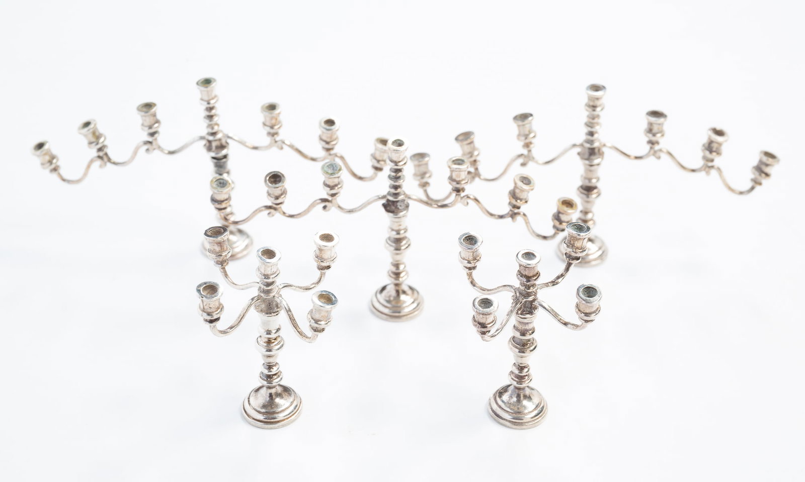 FIVE MINIATURE STERLING SILVER DOLLHOUSE CANDELABRA. (1 of 3)
