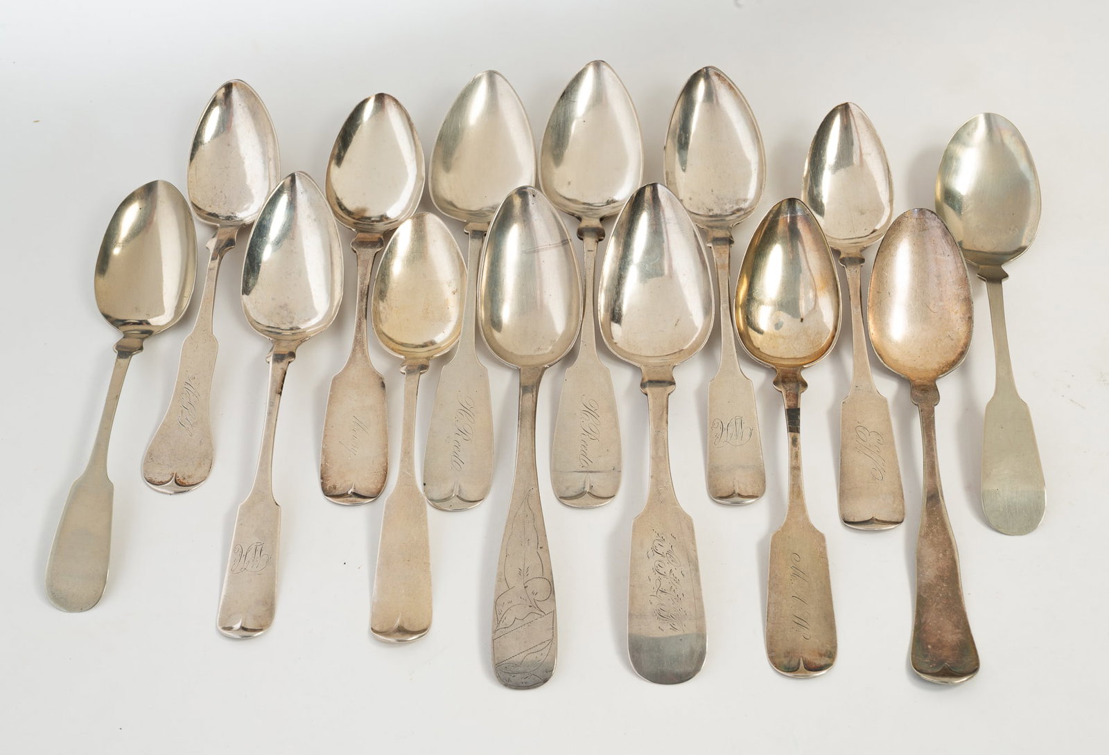 FOURTEEN AMERICAN COIN SILVER SERVING SPOONS. (1 of 6)