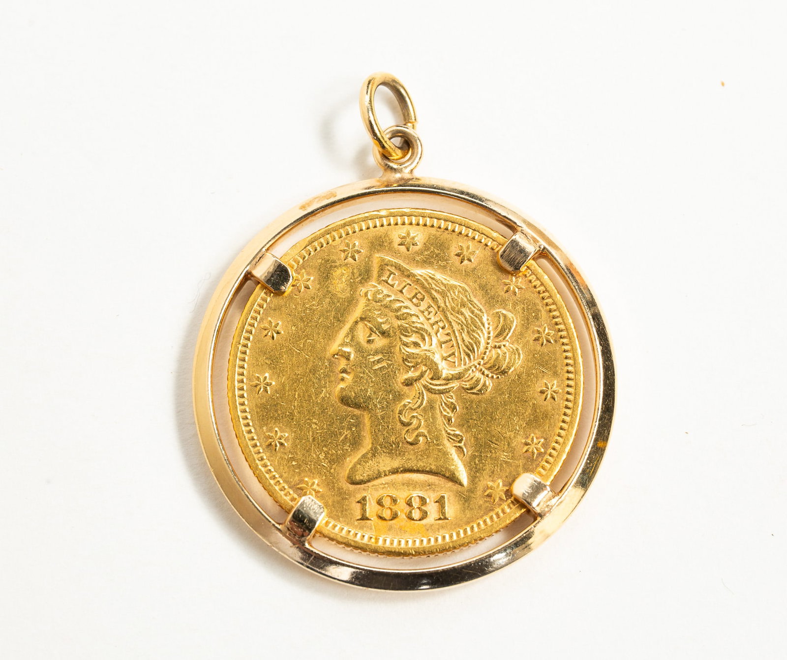 1881-S LIBERTY HEAD 10-DOLLAR GOLD COIN IN 14K BEZEL. (1 of 2)