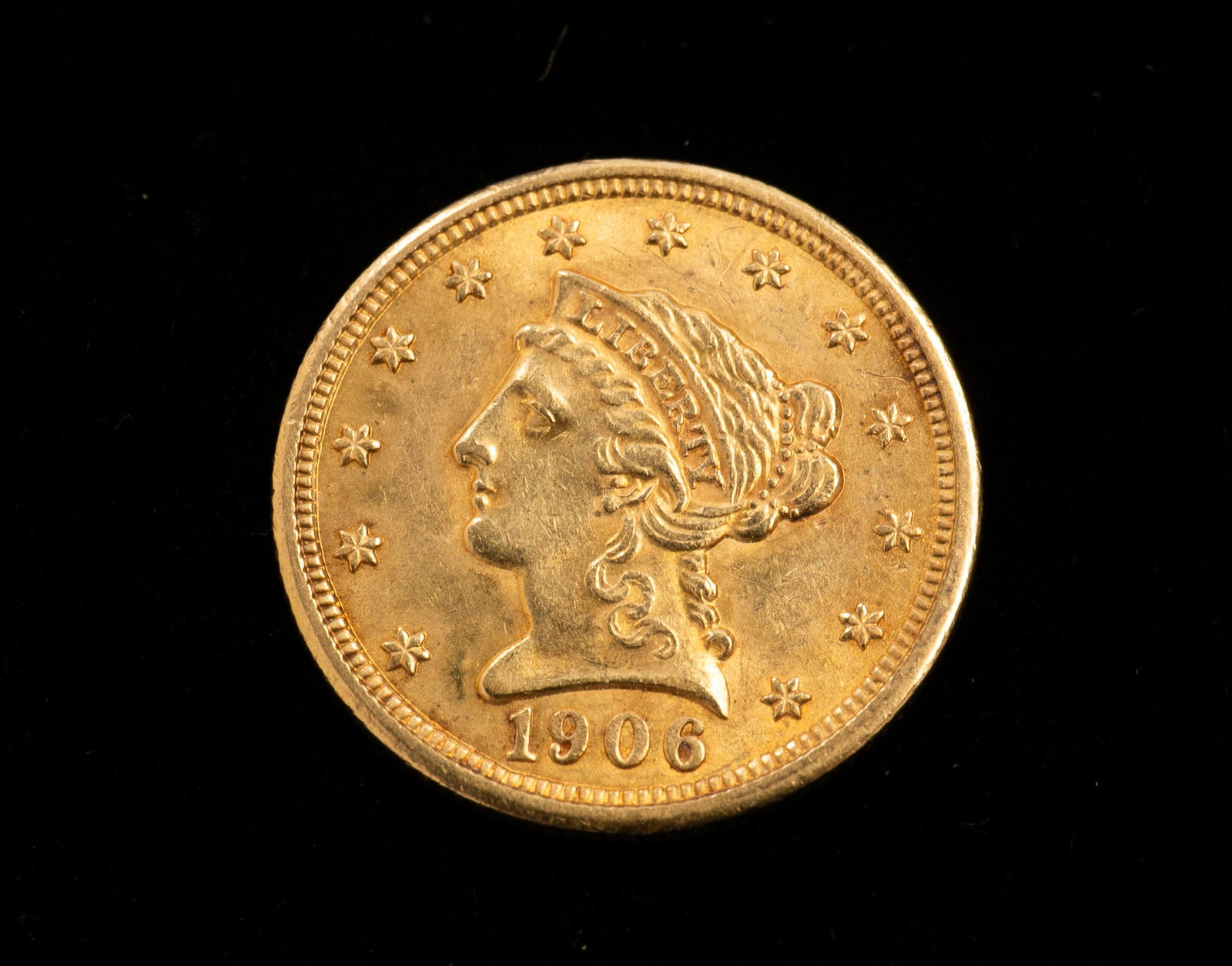 1906 $2.50 LIBERTY HEAD GOLD QUARTER EAGLE.: American, 20th Century. Liberty head to front and eagle to back. 18mm. Approximately 4.16g.*We do not grade or qualify coin condition. Bidder should make their own good judgment based on photos or in-